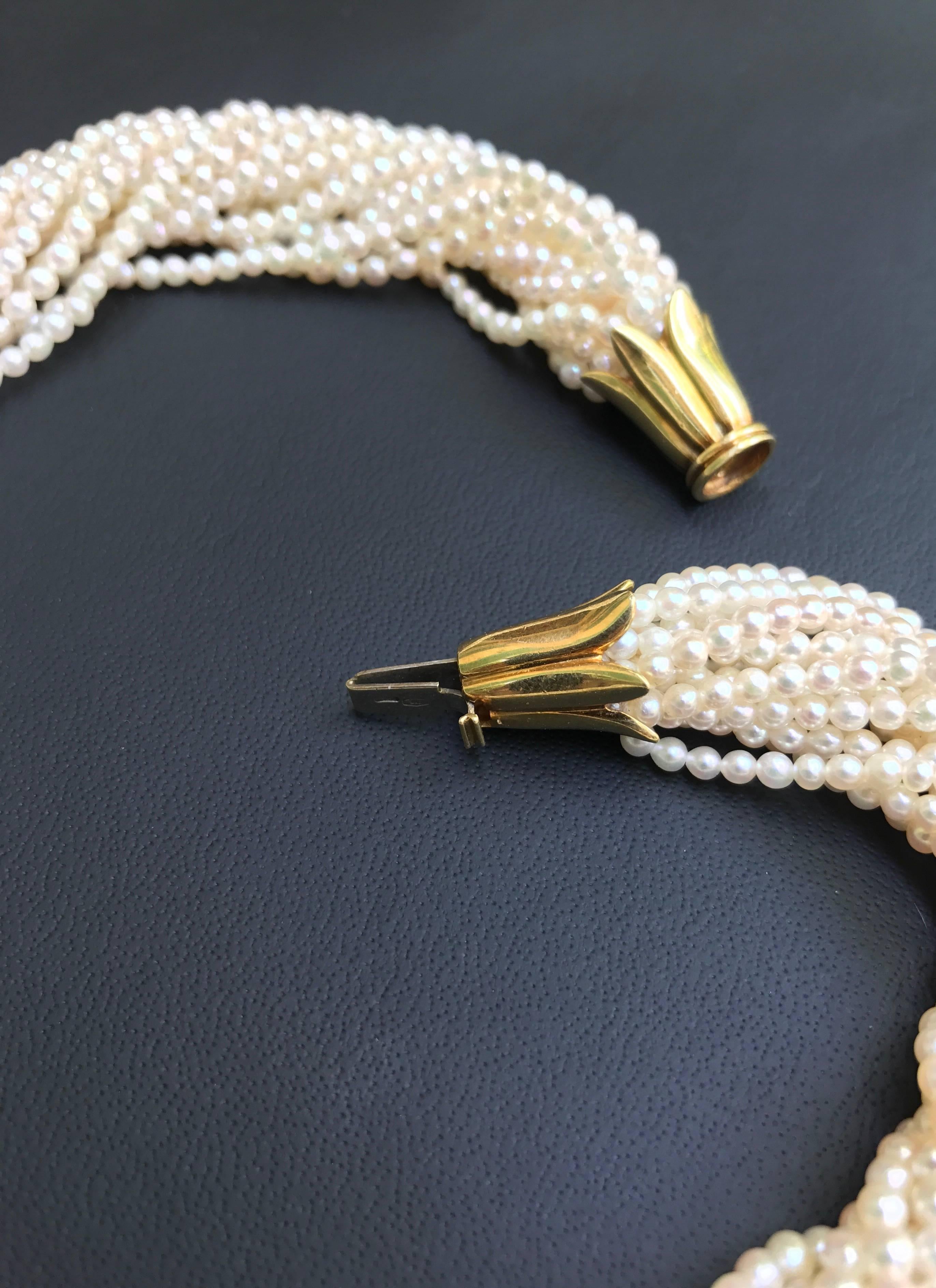 The perfect combination of pearl and the 18 kt gold clasp make this necklace a true standout. 
Elegant fifteen strand pearl Torsade twisting around each other create a thick necklace that has a timeless beauty.

All AVGVSTA jewelry is new and has