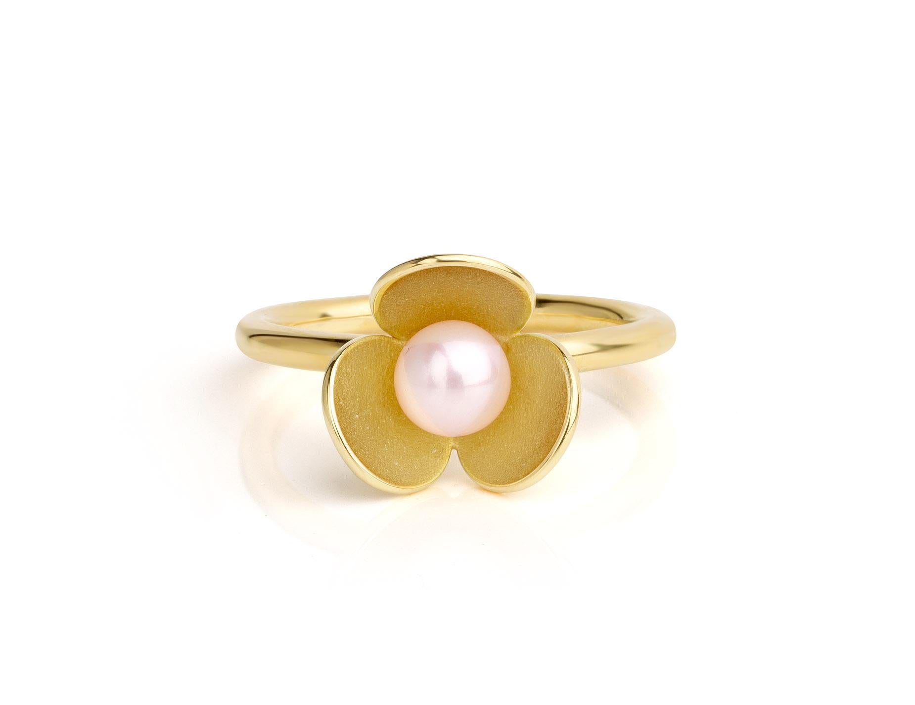 New flower ring with excellent quality light pink color fresh water pearl. 
Beautiful in its simplicity. 
Would look great with a wedding dress but it's design is also timeless!
Hand made of 18 karat yellow gold by master goldsmith Eva Theuerzeit