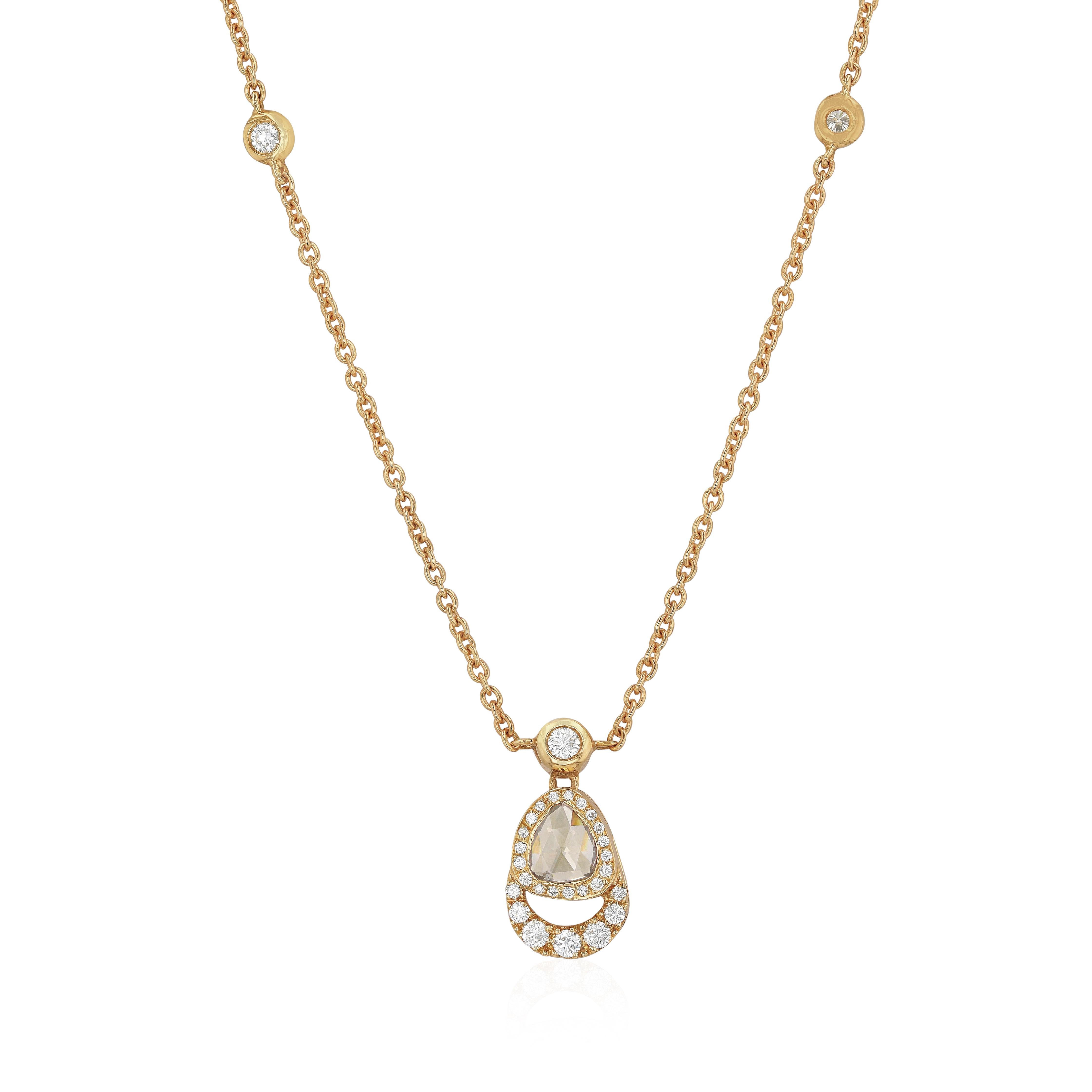 Designed with a charm, the Palm Tree pendant is rendered in yellow gold and set with faceted white diamonds. It features a polished tear-shaped pendant that is adorned with rose cut brown diamond.
- Diamonds (Total Carat Weight:0.77ct) 
