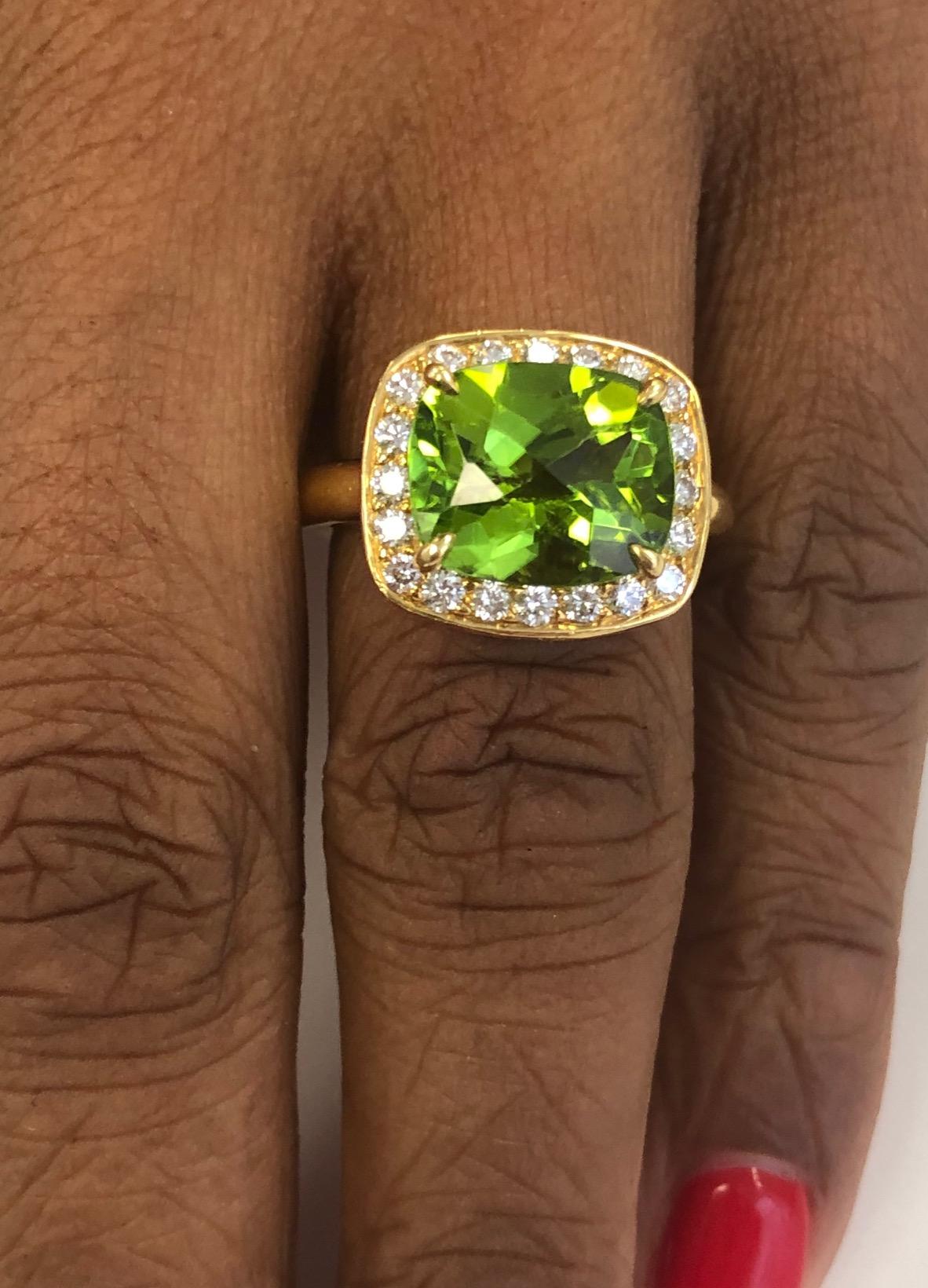 This beautiful Ring is perfect for everyday use,The ring is constructed for a perfect fit and comfort.
The ring is made in 20 kt Yellow Gold, set with 20 diamonds 0.48 carats and a cushion Peridot 5.50 carats.
The ring finger size is 6-3/8 ( EU