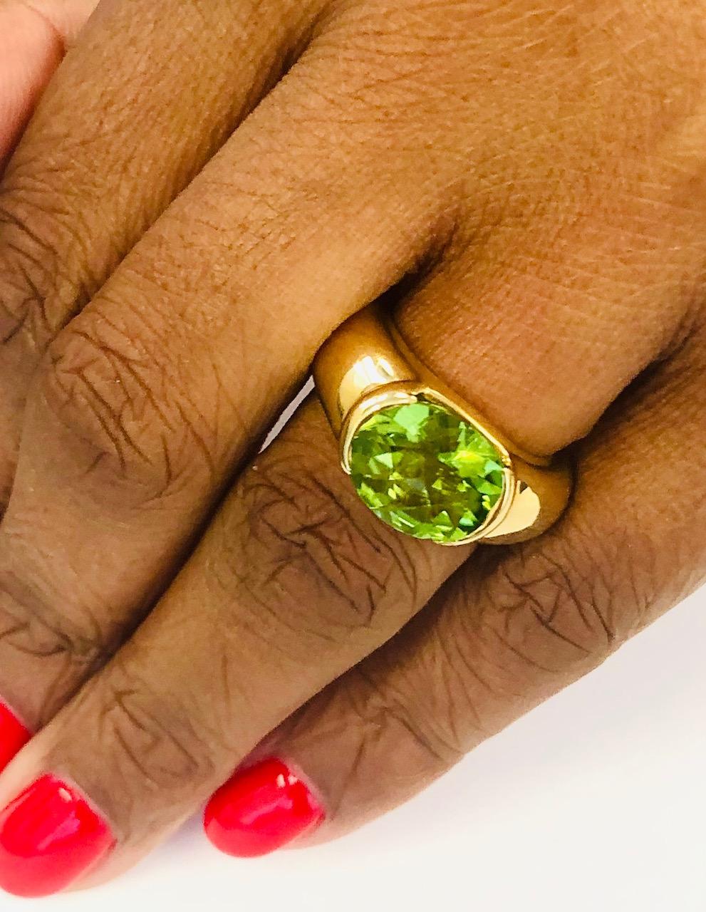 Bombe 18 Kt Yellow Gold Ring, set with an Oval Peridot 7.50 carats, this is a bold powerful look !
Finger ring size is 6 (EU 52), Also available with many other color stones.

We manufacture all of our jewelry, in our workshop, located  in New York