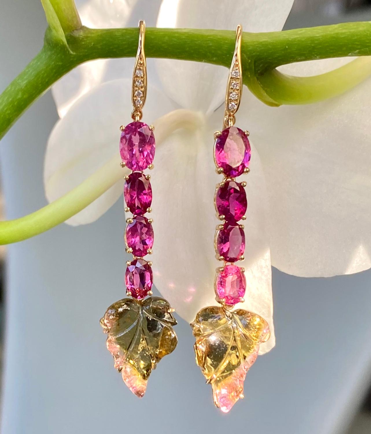 Oval pink tourmalines, carved bicolor tourmaline leaves and diamond earrings, handcrafted in 18 karat yellow gold.

These beautiful dangle earrings of vibrant pink and unique carved bicolor leaves are in bloom, perfect for the spring and summer