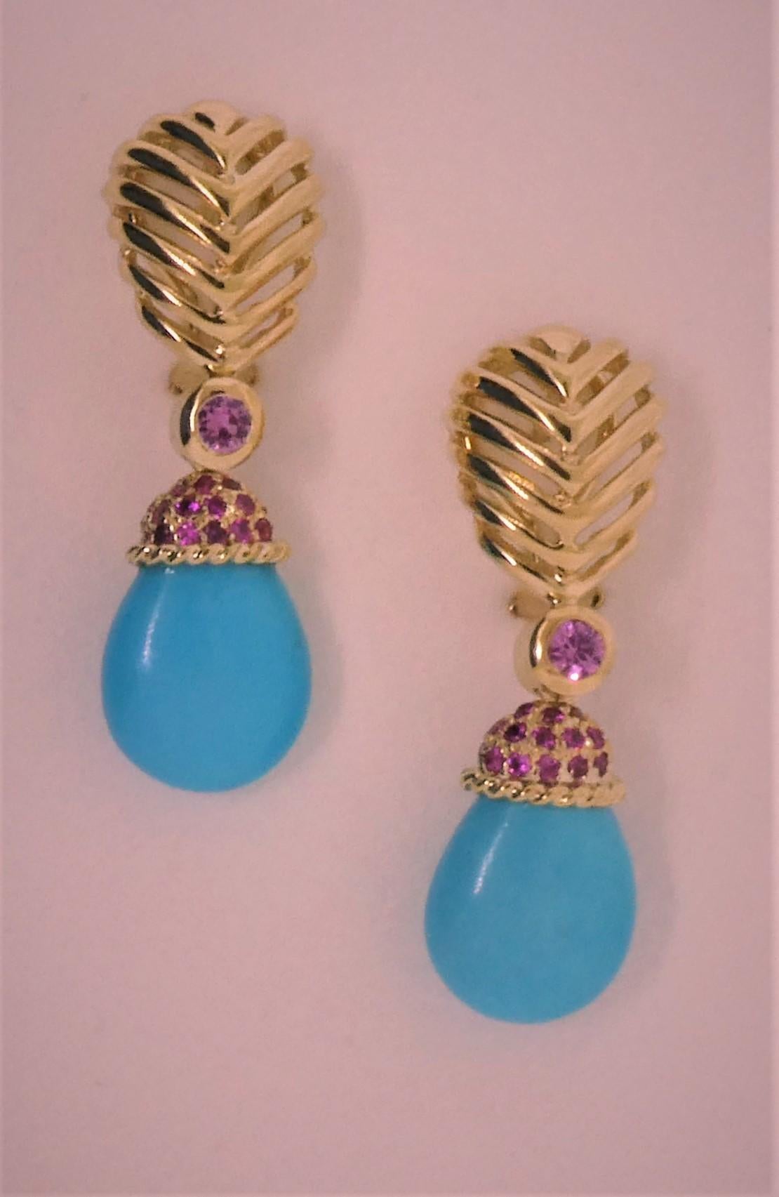 Created by Michael Engelhardt, this lovely pair of Turquoise drop earrings is really easy and light to wear.  With the use of a clip and post to make the earrings lighter on the ear, the Turquoise drops hang from an 18 Karat yellow gold cap set with