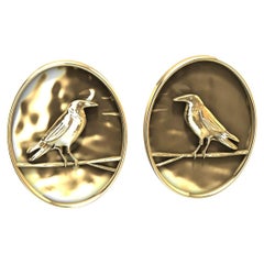 Boucles d
oreilles corbeau plaquées or jaune 18 carats