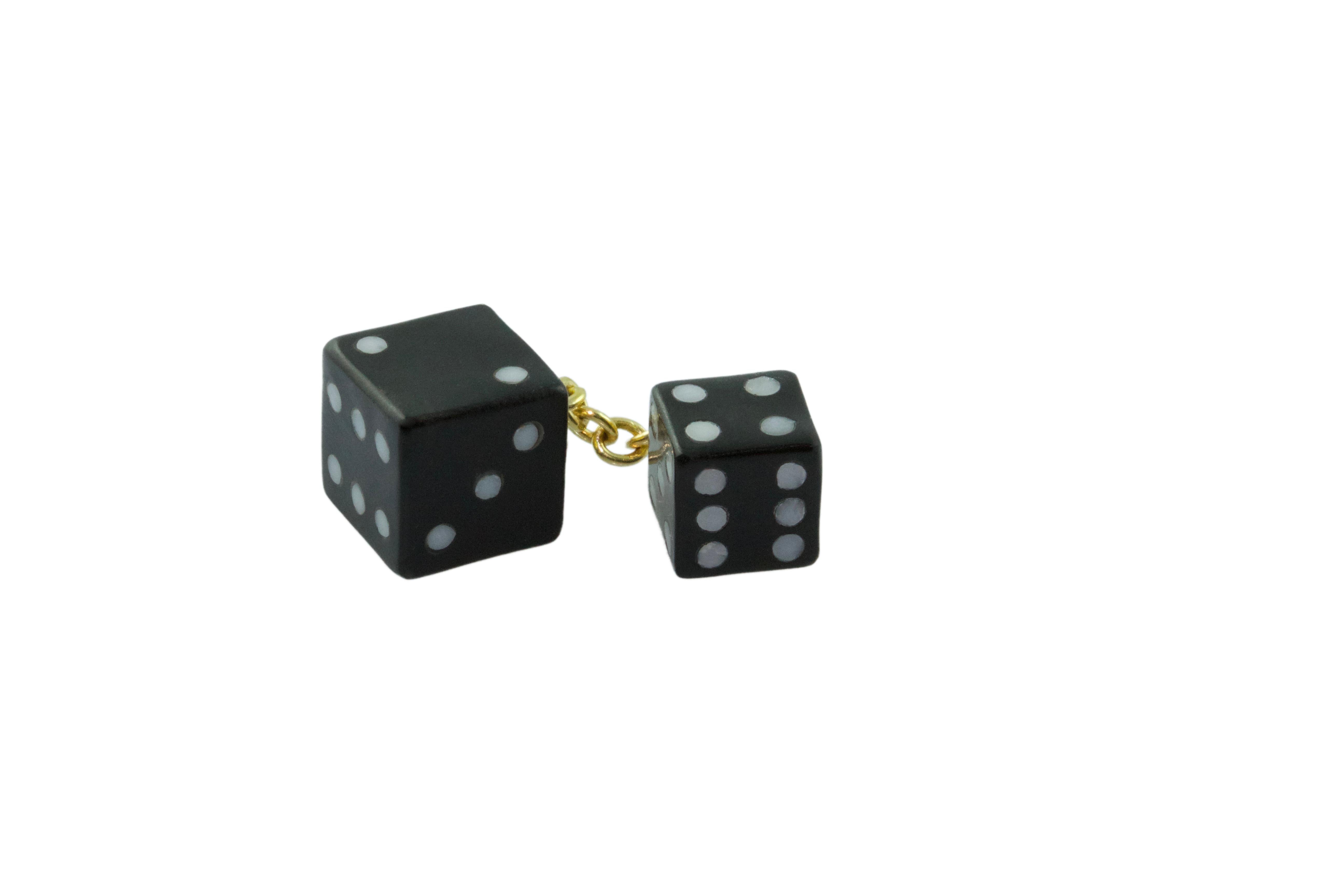 This sophisticated pair of cufflinks is entirely made of black of Belgium stone, the front face is shaped as a playing dice with its striking black surface highlighted by white agate to recreate the faces of a dice , 
the toggle is a smaller dice