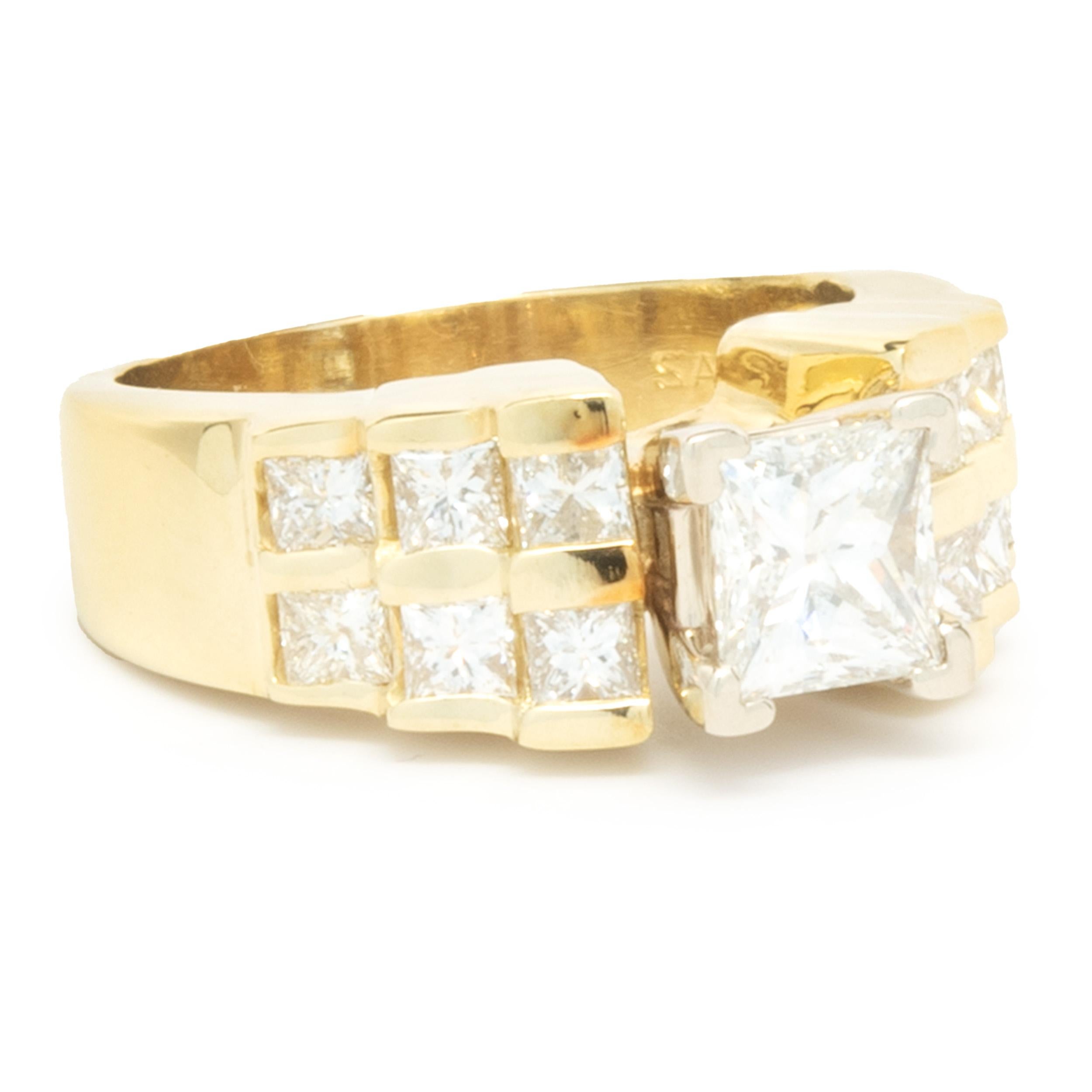 Designer: custom
Material: 18K yellow gold
Diamond: 1 princess cut = 1.44ct
Color: H
Clarity: VS2
Diamond: 12 princess cut = 1.00cttw
Color: H 
Clarity: VS2
Dimensions: ring top measures 8.5 mm wide
Ring Size: 6.5 (complimentary sizing