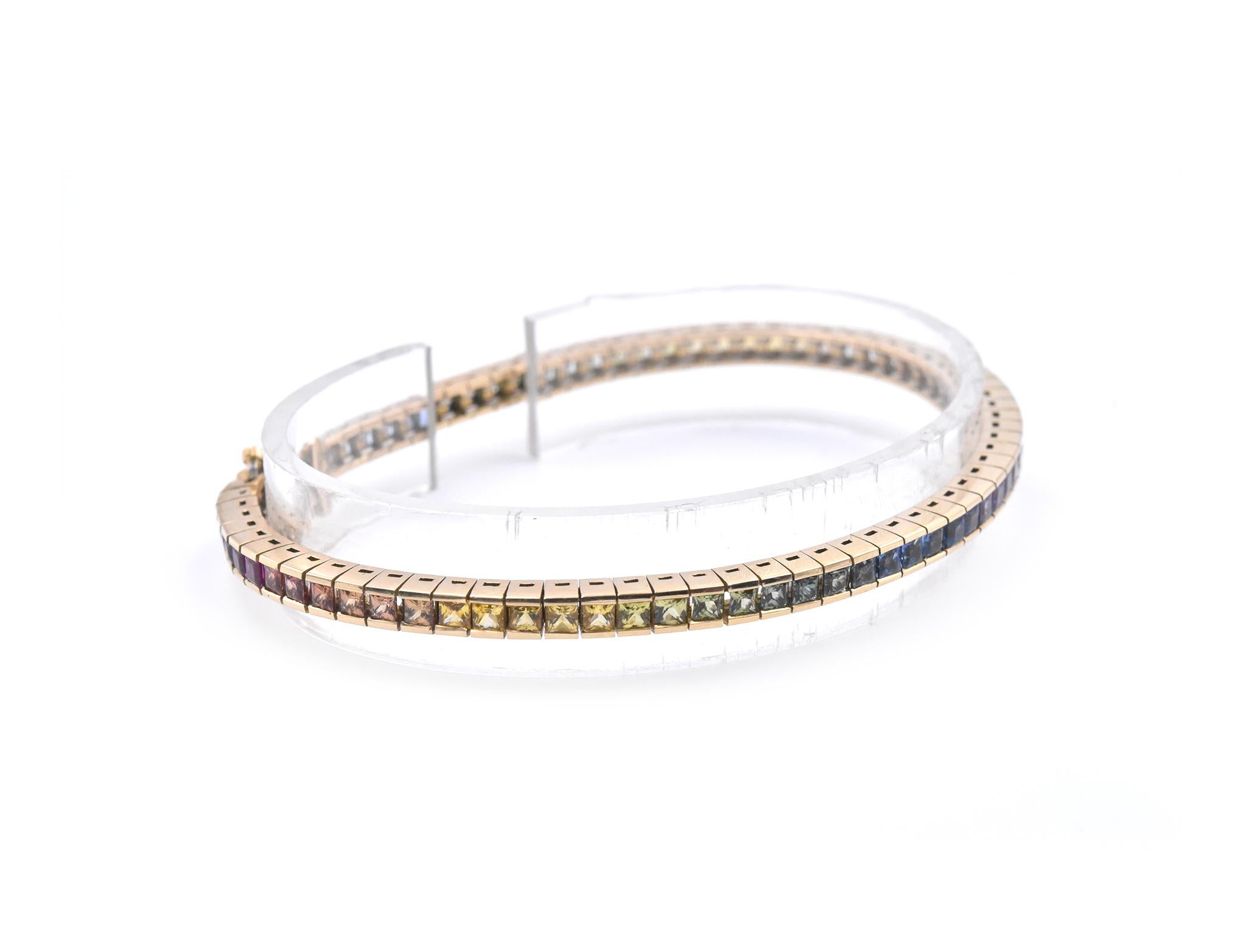 Designer: Custom
Material: 14K yellow gold
Gemstone: princess cut sapphires
Carat: 4.20cttw 
Dimensions: bracelet will fit a 7-inch wrist
Weight: 17.27 grams