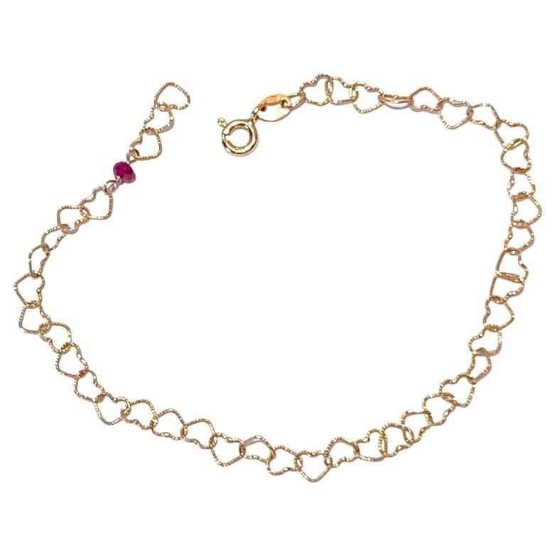 18 Karat Yellow Gold Red Ruby Slightly Hammered "Little Hearts" Chain Bracelet