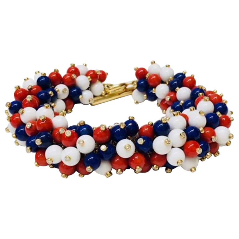 18 Karat Yellow Gold Red, White and Blue Bracelet, Ring and Earring Suite For Sale
