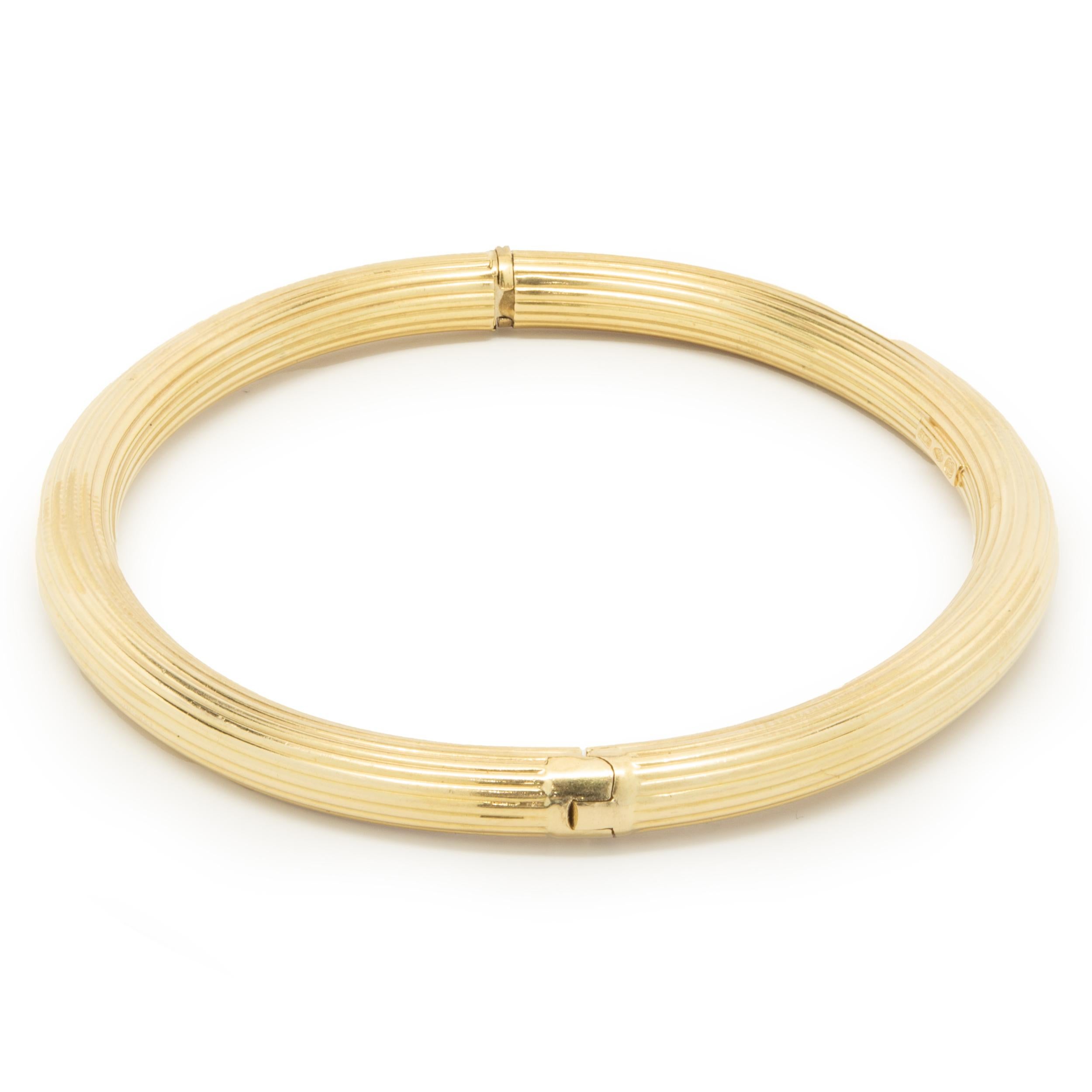 Material: 18K Gelbgold
Abmessungen: Das Armband passt an ein Handgelenk von bis zu 7 Zoll
Gewicht: 11,46 Gramm
