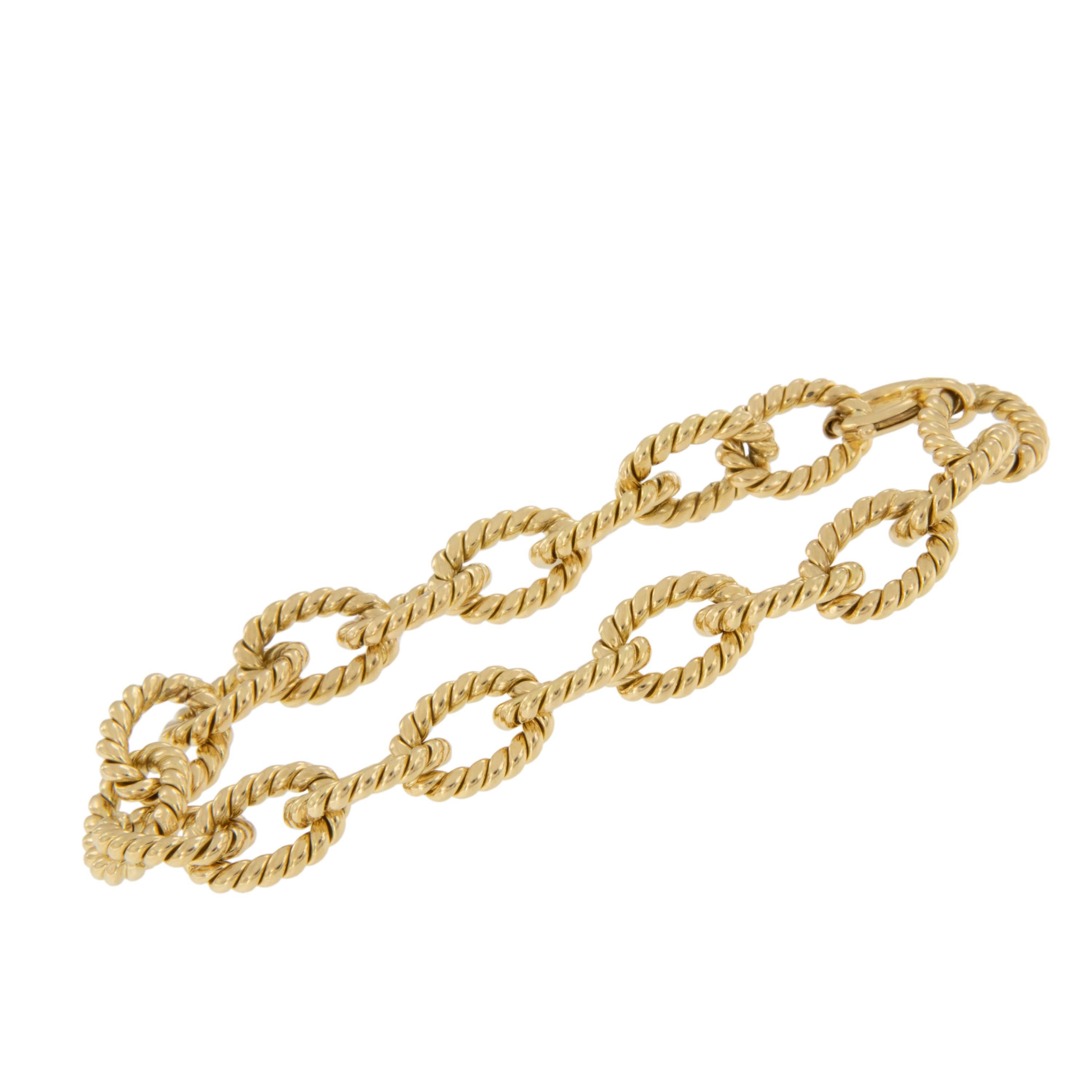 This beautiful bracelet holds it's own worn by itself and also looks fantastic paired or stacked with other bracelets! Made from rich hued 18 karat yellow gold with ribbed cable links for a twist on traditional. Bracelet is 7.5