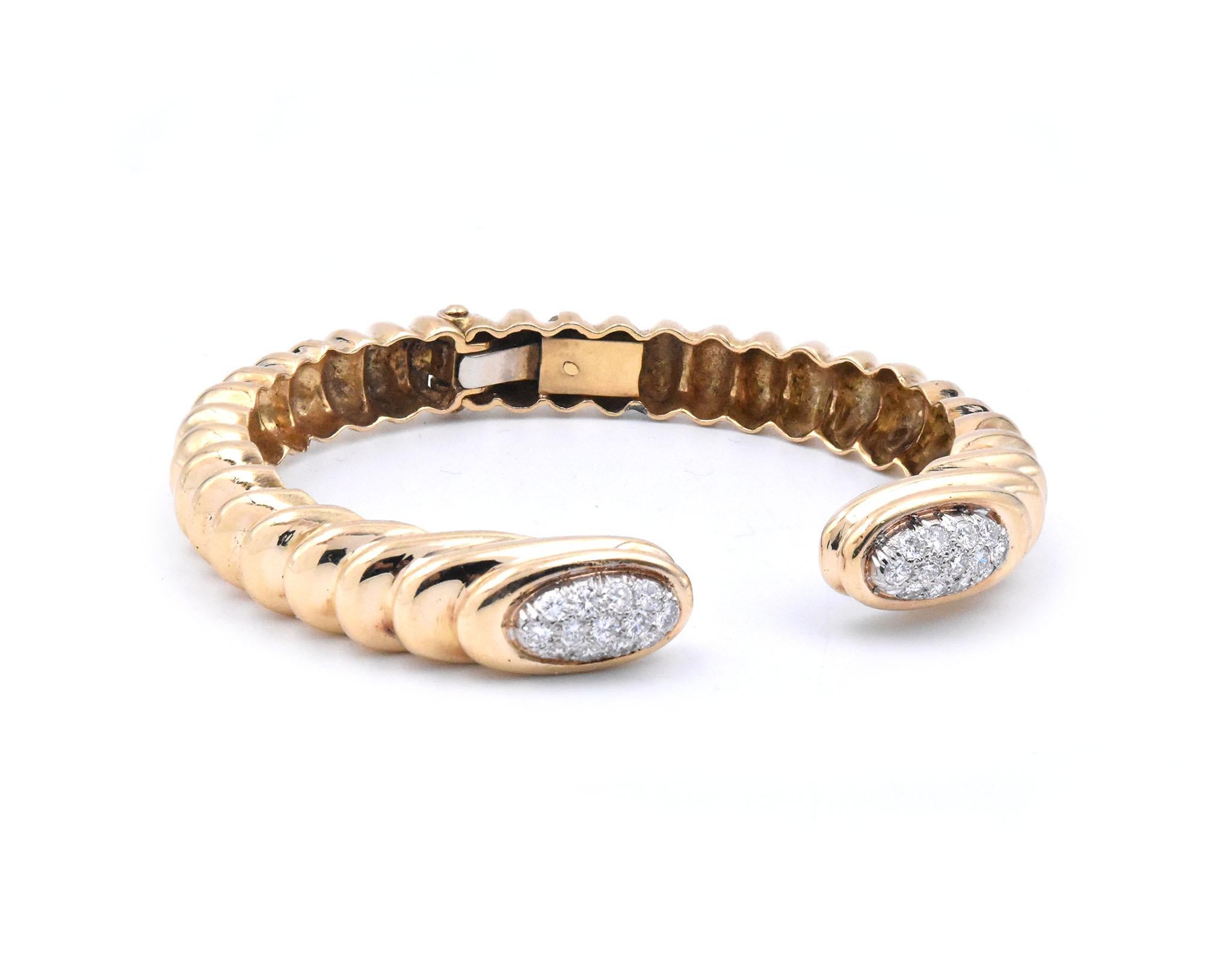 Material: 18K yellow gold
Diamonds:  26 round brilliant cut = 1.20cttw
Color: G
Clarity: SI1
Dimensions: bracelet will fit up to a 7-inch wrist
Weight: 39.41 grams