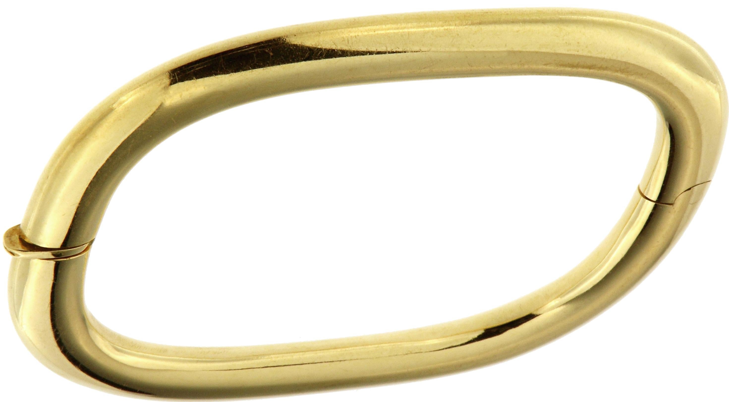 1980s Cuff Bracelet in 18k yellow gold. The width is 4 x 8 mm / 0.157 x 0.314 inches. The inner dimension of the bracelet are 58 x 45 mm / 2.283 x 1.771 inches. Handcrafted in Italy. They are marked with the Italian Gold Mark