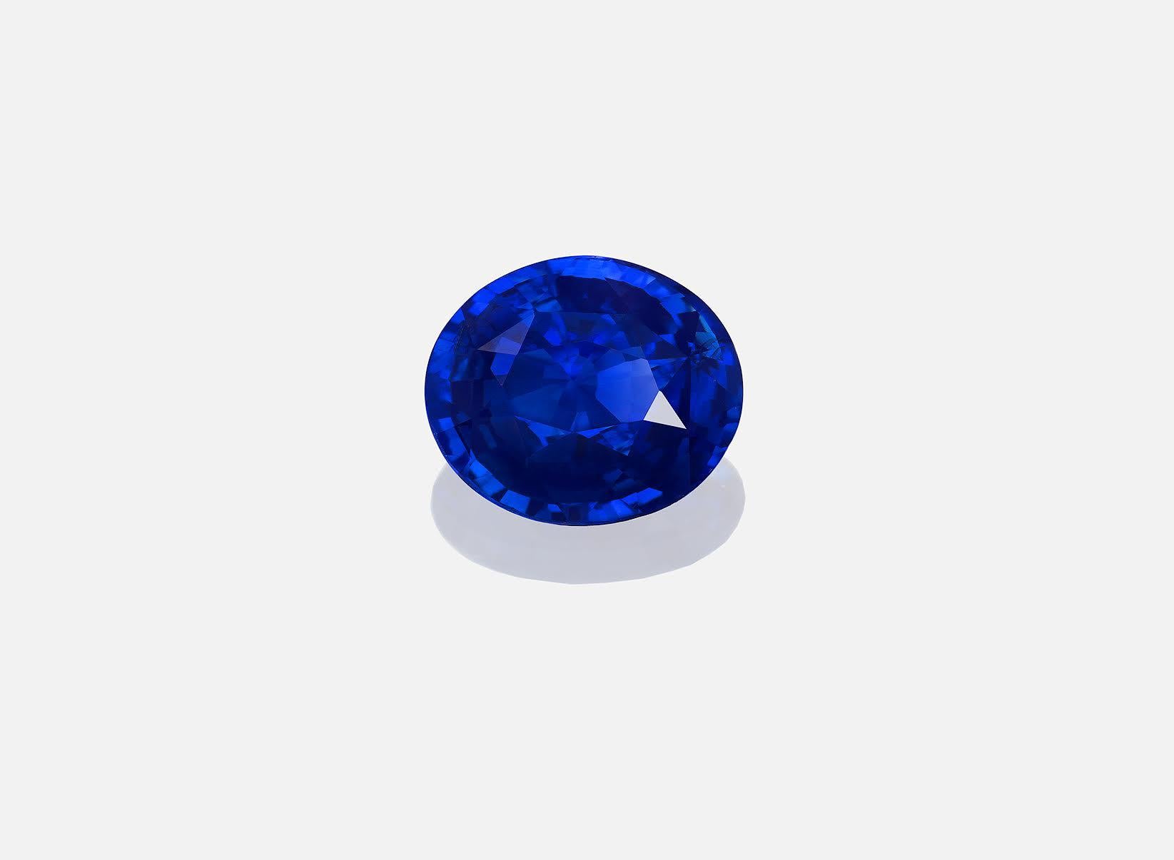 Oval Cut Four Carats Vivid Blue Sapphire Eighteen Karat Yellow Gold Ring with Diamond For Sale