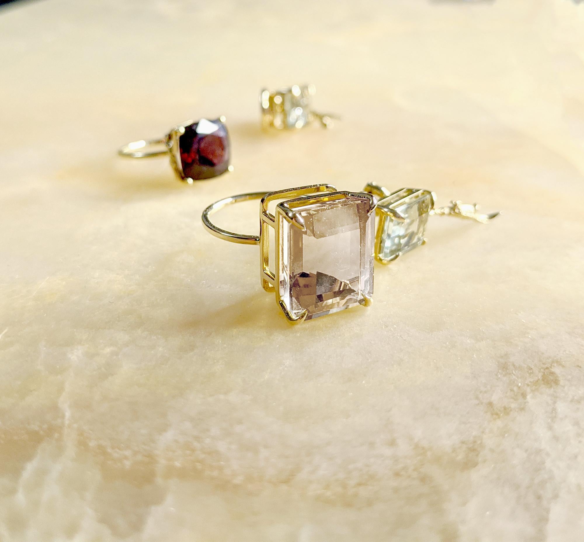 This ring features a huge emerald-cut kunzite set in 18-karat yellow gold. The size of the ring is custom-made to fit the wearer's finger. The large size of the gem is sure to catch attention, with its vivid and rich color, as well as the exquisite