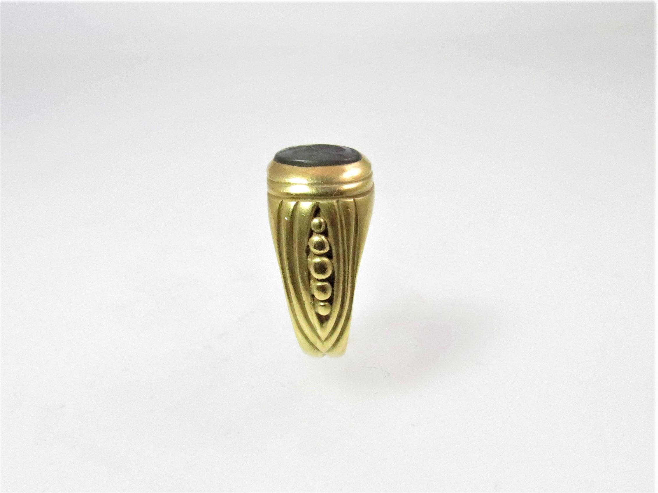 Oval Cut 18 Karat Yellow Gold Ring with Carved Black Onyx Intaglio