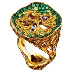 18 Karat Yellow Gold Ring with Diamonds Tsavorites and Yellow Sapphires