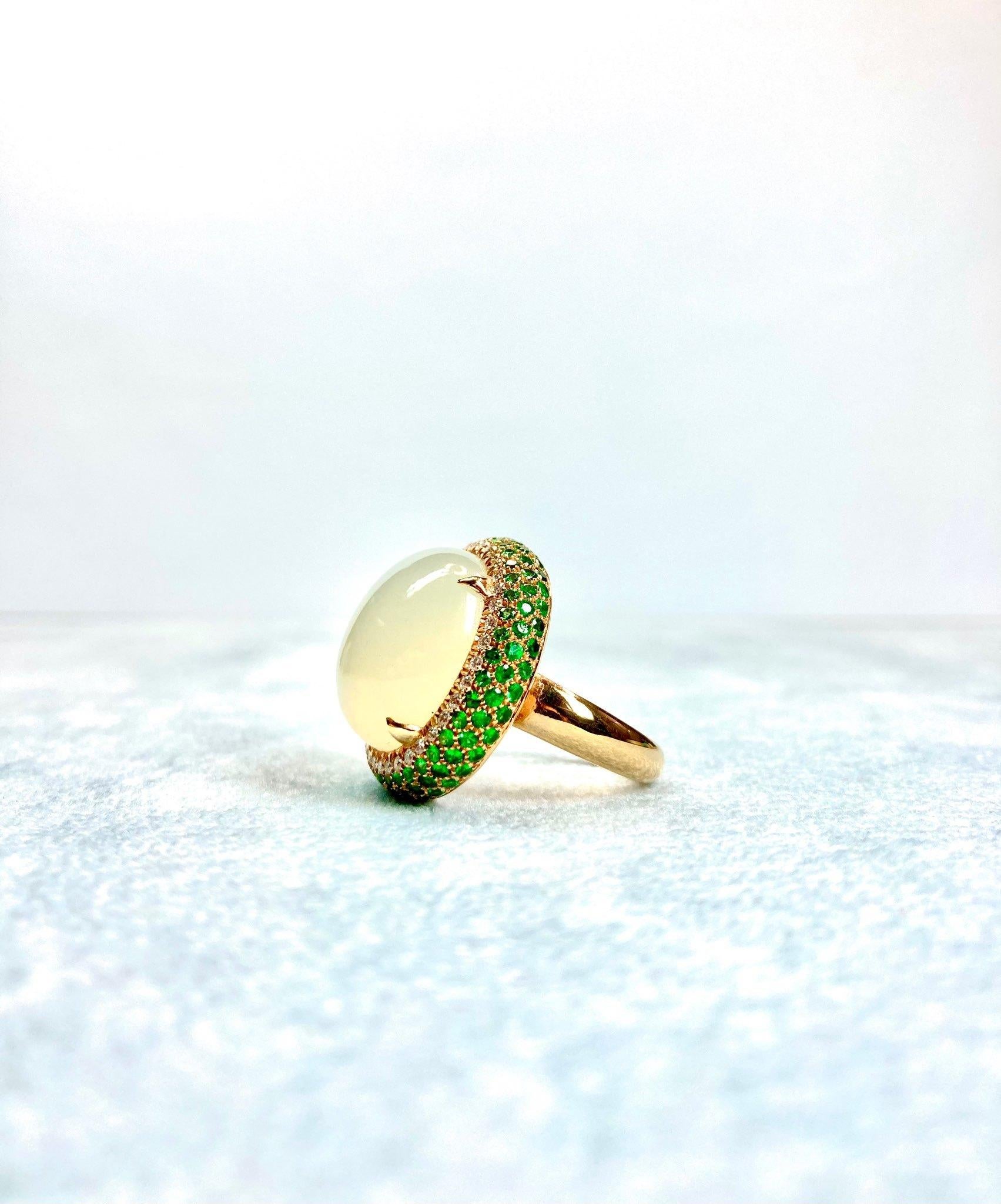 Timeless elengat yellow gold ring, with central moonstone ct. 20, diamonds ct. 0.34, tsavorite ct. 0,34, made in Italy by Roberto Casarin. 

Size: 13,5 (6 USA)

The item will be delivered to you in an elegant Roberto Casarin signature packing (pouch