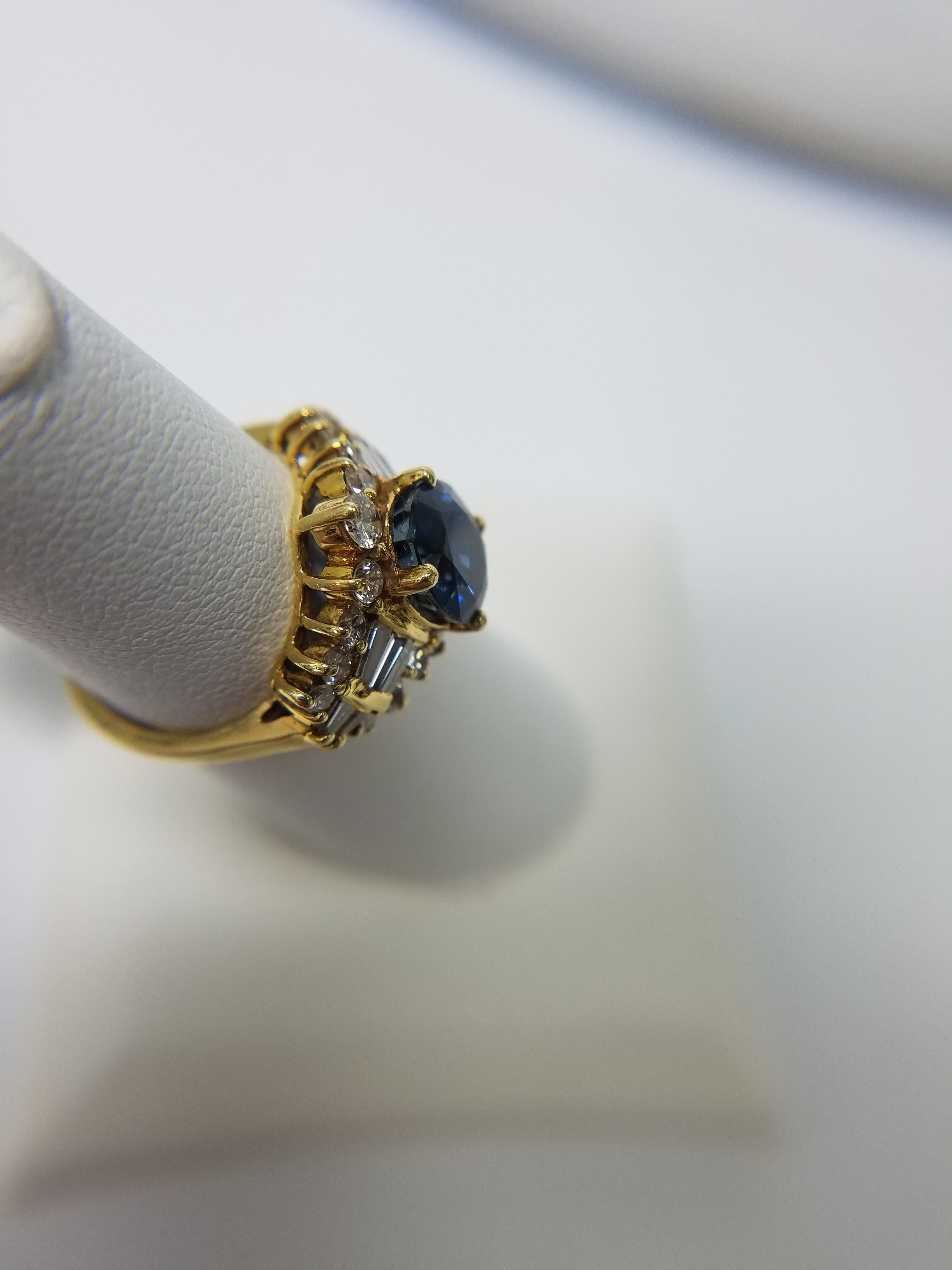 Women's 18 Karat Yellow Gold Ring with Sapphire Center Stone and Diamonds
