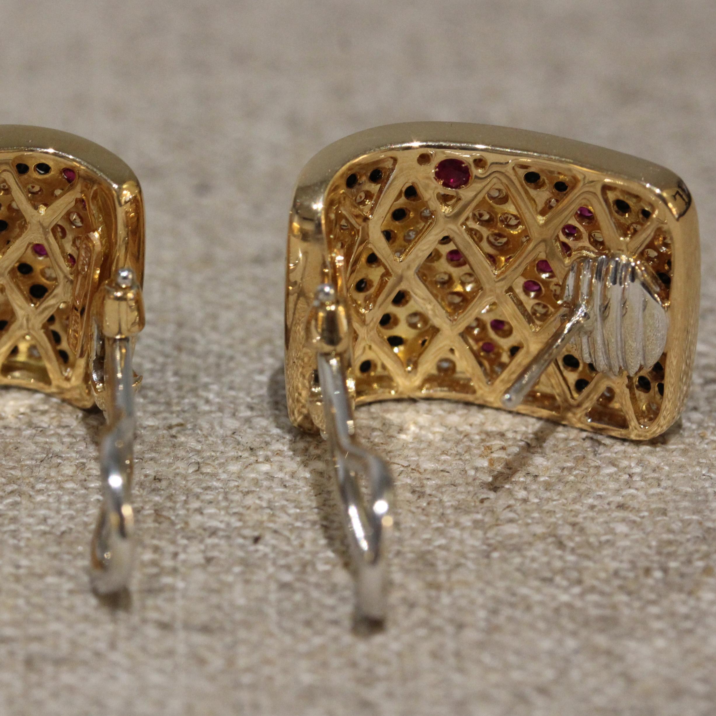 18 karat yellow gold Roberto Coin diamond earrings featuring a Burberry like pattern. 