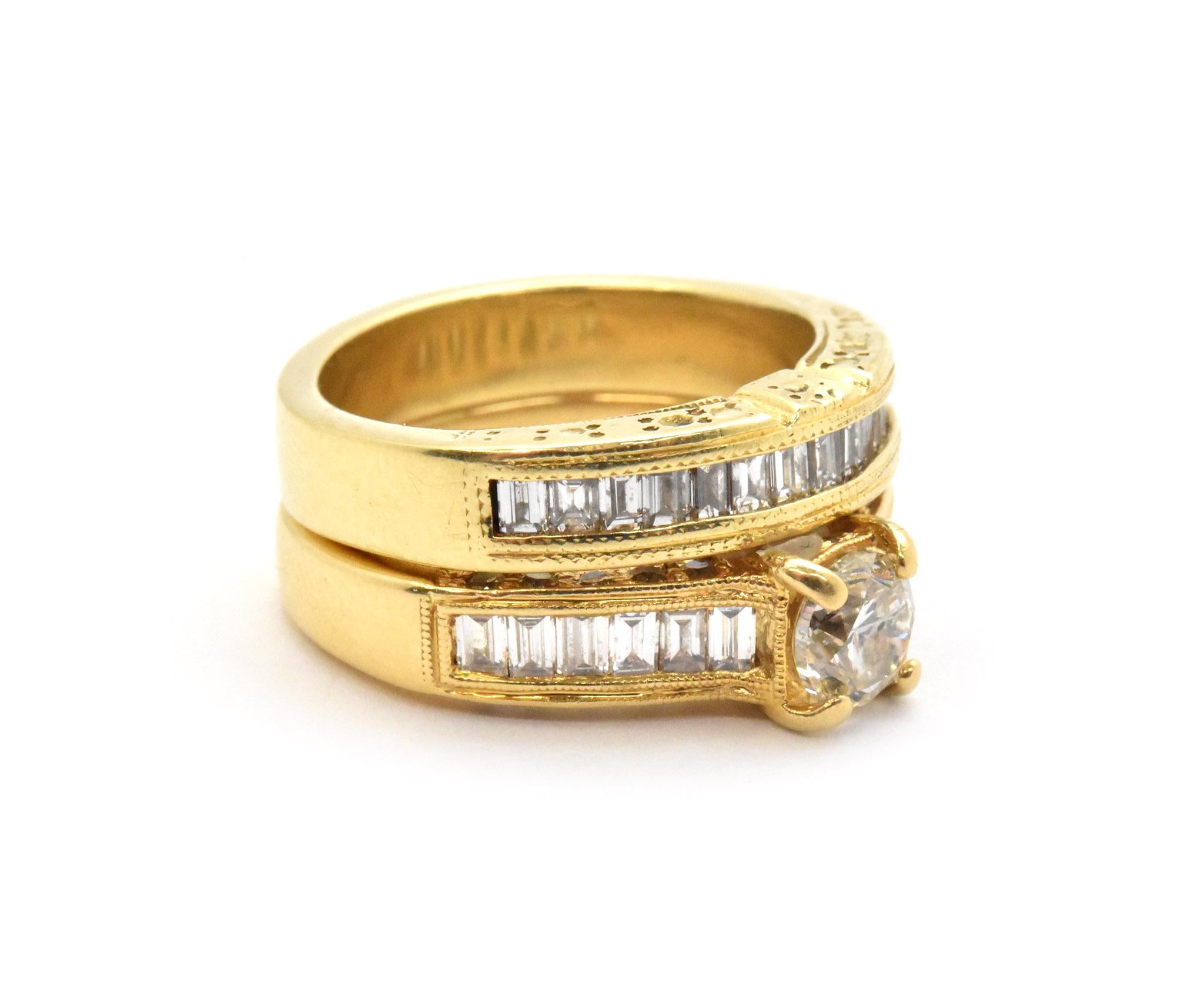 This momentous bridal set is made in 18k yellow gold and features a sparkling round brilliant 0.50ct diamond at the center of her engagement ring, set into the shoulder of each band in the wedding set are baguette diamonds. The center diamond in her