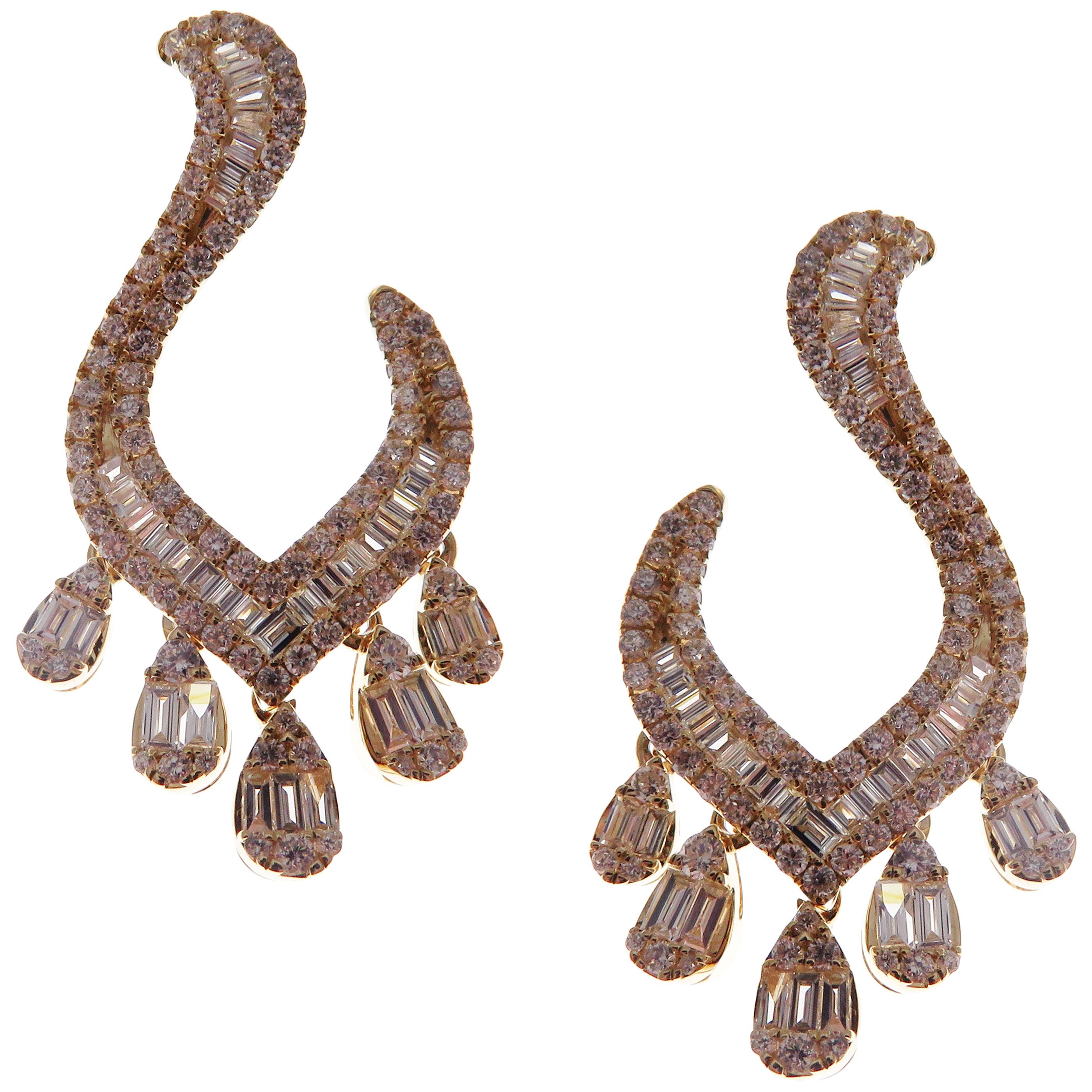 These trendy tassel twisty earrings with white baguette diamonds are crafted in 18-karat yellow gold, featuring 174 round white diamonds totaling of 1.17 carats and 71 baguette white diamonds totaling of 0.89 carats.
These earrings come with push