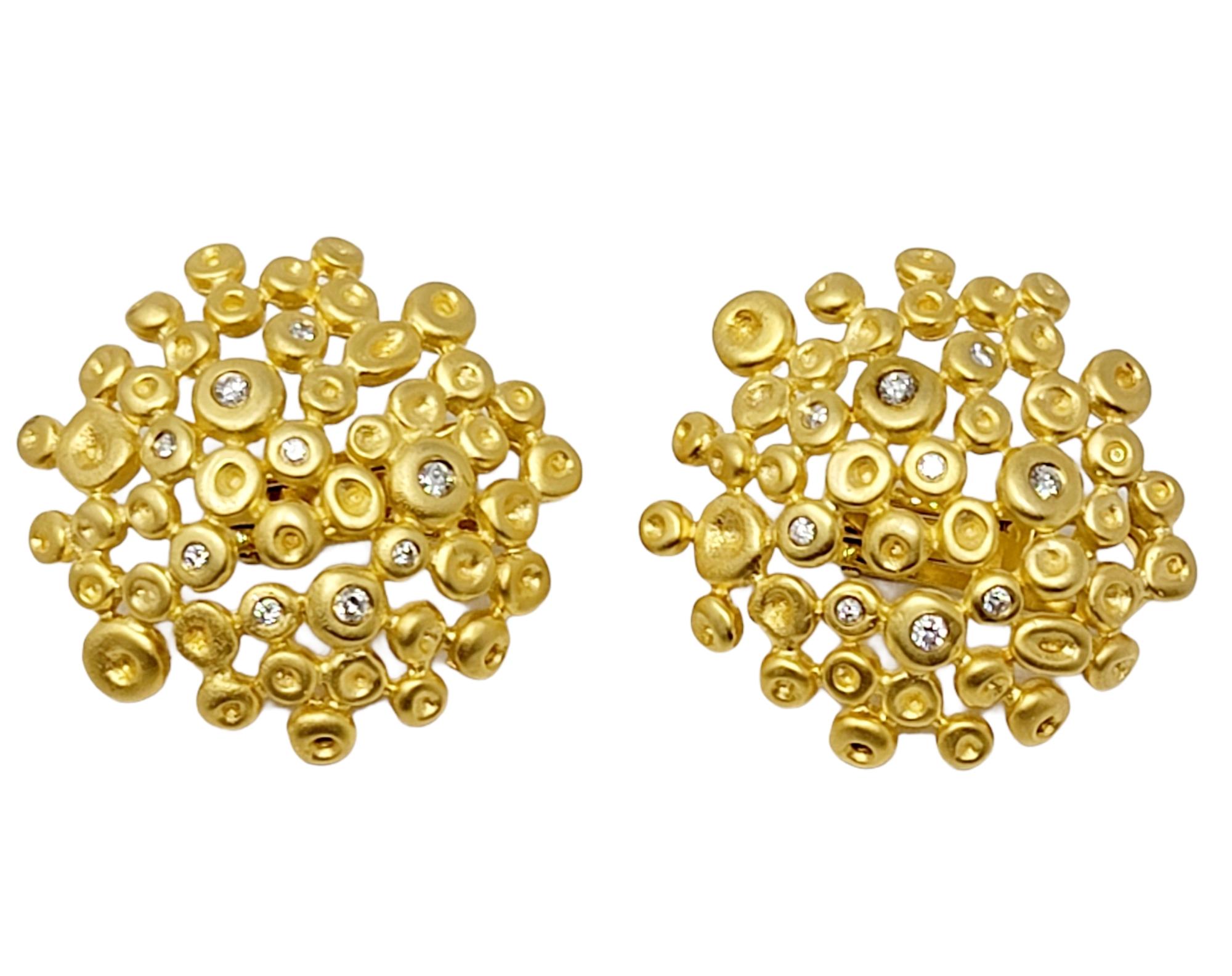 These chic earrings exude modern elegance. The stunning brushed gold design accented with twinkling diamonds will be your new go-to pair! The earrings feature a collection of matte finished 18 karat yellow gold 'bubbles