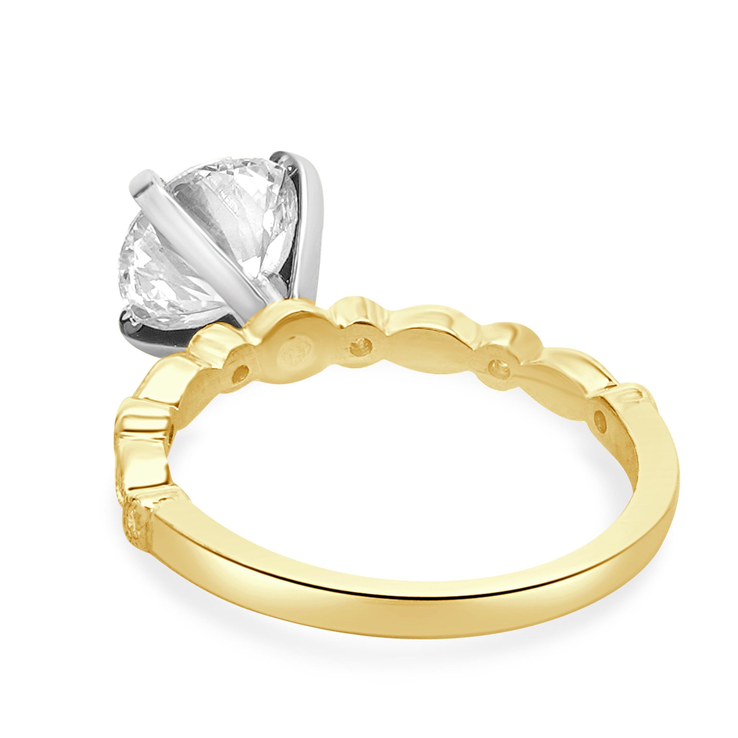 Designer: custom
Material: 18K yellow gold
Center Diamond: 1.70ct round 
Color: J
Clarity: SI1
GIA: 6242041764
Diamonds: 14 round cut= 0.20ct
Color: H
Clarity: SI1
Ring Size: 5.5 (please allow two additional shipping days for sizing