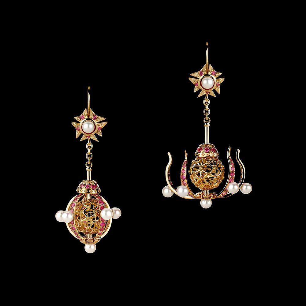 Transforming Chandelier earrings in 18K gold set with brilliant rubies and Akoya pearls in a Pomander motif. Can be worn closed (round form) or open (chandelier form). A unique modern take on an antique style.

