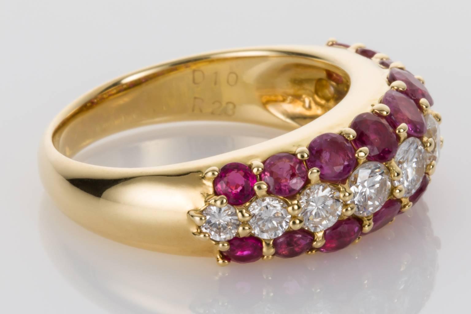 Elegant and stylish, wearable and stackable if desired. This lovely band is set with 10 brilliant cut white diamonds weighing approximately 0.65cts and 18 glorious red rubies with an estimated weight of 1.35cts mounted in 18k yellow gold. The