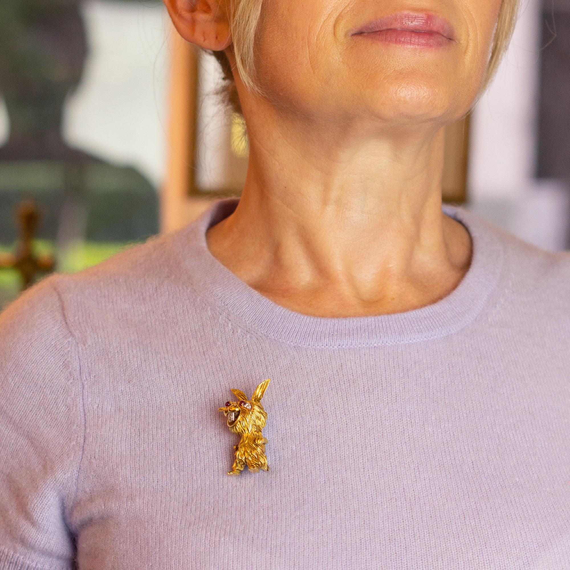 A playful brooch pin in the form of a rabbit, crafted from 18 karat yellow gold. The piece which is modelled after a Kutchinsky design is signed 'HB' and 'Es in France' which suggests it is a later piece in the Kutchinsky 'taste'. The weighty pin is