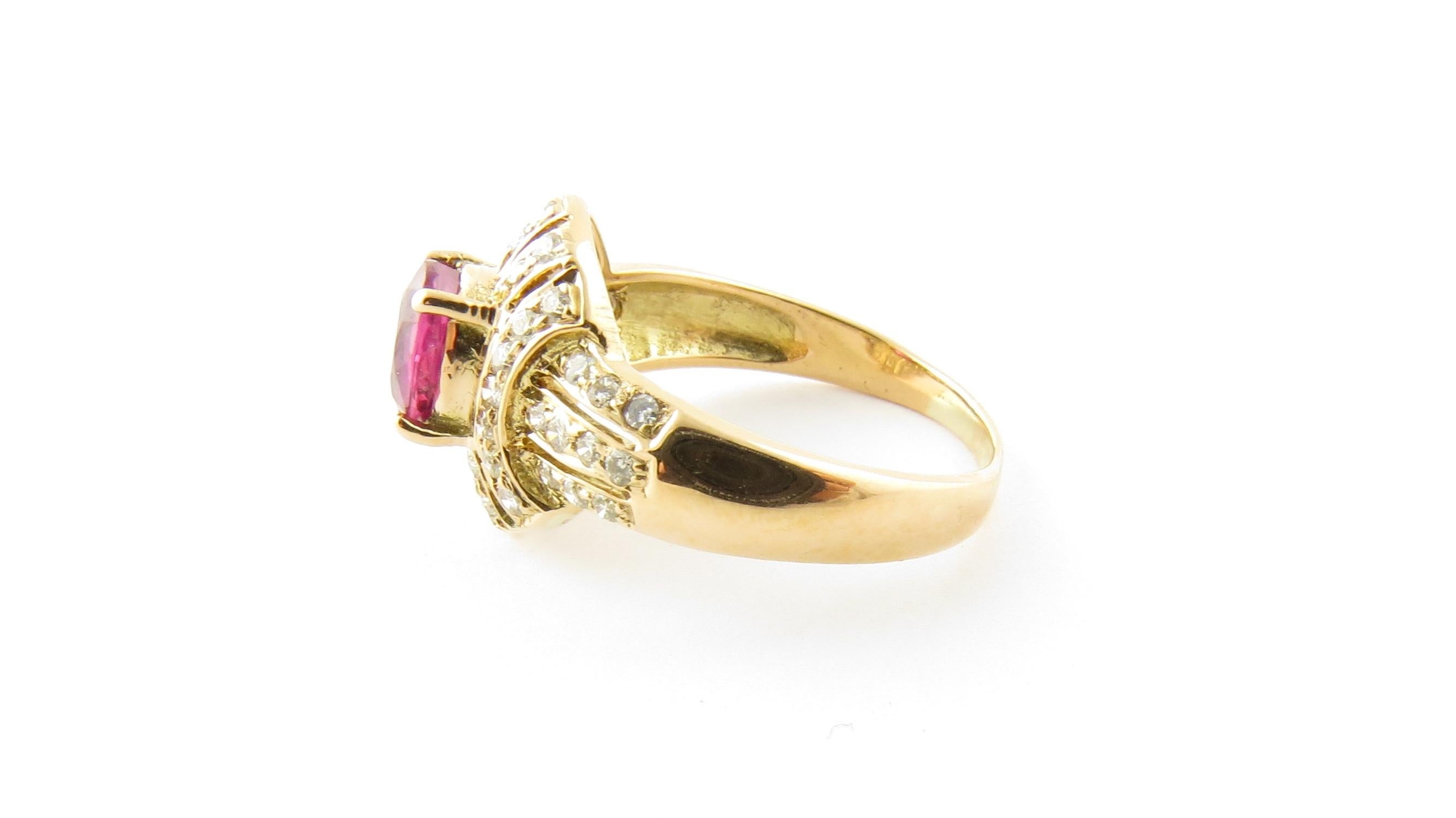Vintage 18 Karat Yellow Gold Ruby and Diamond Ring Size 6.5

This elegant ring features one oval ruby (7 mm x 5 mm) surrounded by 45 round brilliant cut diamond and one round single cut diamond set in classic 18K yellow gold. Top of ring measures 13