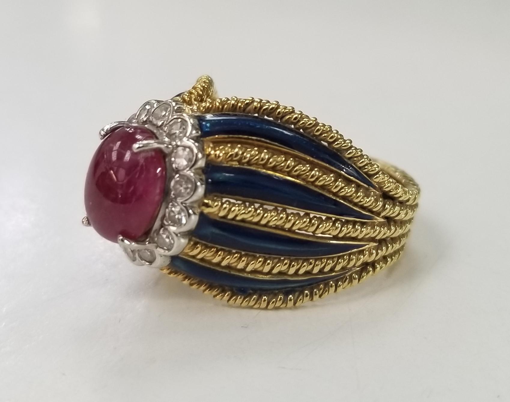 18k yellow gold ruby and diamond ring with 8 blue enamel strips.
Specifications:
    main stone: ROUND DIAMONDS AND BLUE SAPPHIRE
    diamonds: 14 PIECES
    carat total weight: APPROX 0.28 CTW
    main stone: cabachon cut ruby 2.75cts
    color: G
