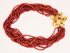 18 Karat Yellow Gold Ruby and Diamond Starfish 12 Strand Faceted Ruby Beads