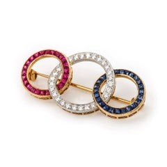 Ruby Diamond and Sapphire 'Tri-Ring' Brooch, 18 Karat Yellow Gold circa 1950s