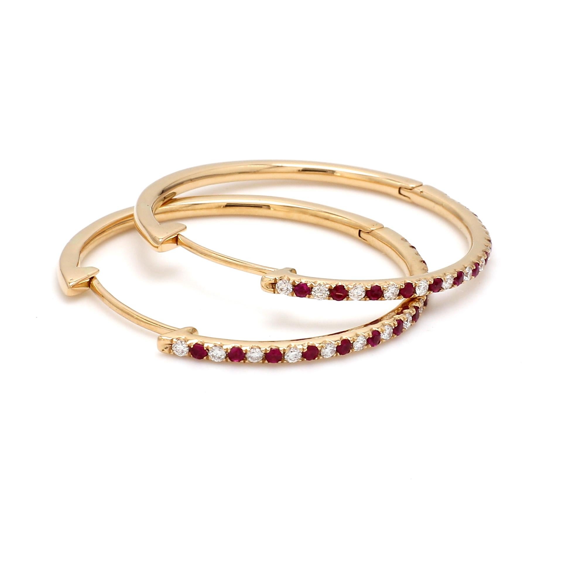 A Beautiful Handcrafted Hoop Earring in 18 karat Yellow Gold with Natural Brilliant Cut Colorless Diamond And  Vibrant Rubies. A Statement piece for Evening Wear

Natural Diamond Details
Pieces : 26 Pieces
Weight : 0.28 Carat 
Clarity of Diamond :