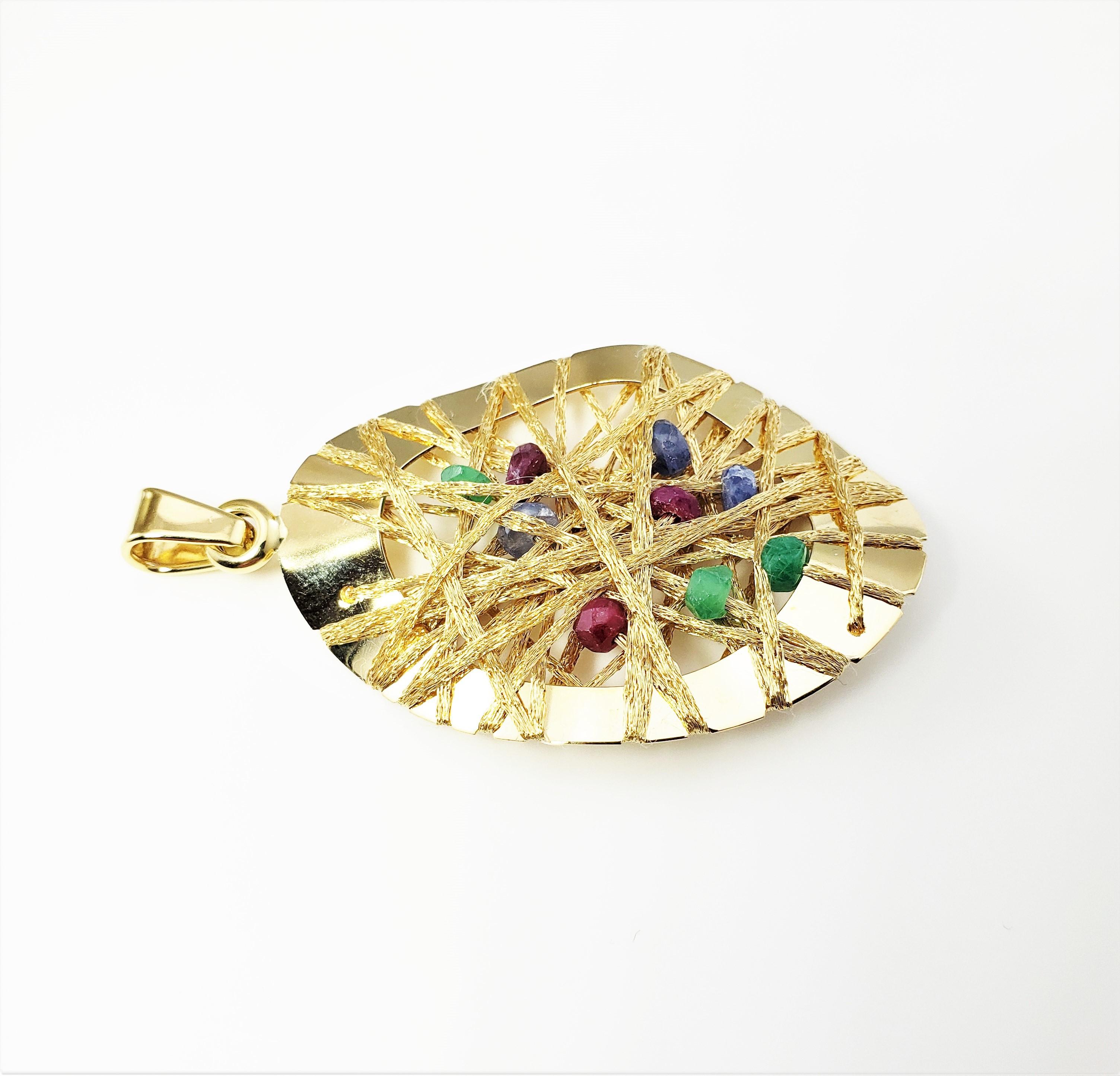 Vintage 18 Karat Yellow Gold and Multi-Colored Gemstone Pendant-

This spectacular pendant is crafted in a unique string design in beautifully detailed 18K yellow gold. Decorated with nine rough-cut gemstones (three rubies, three sapphires and three