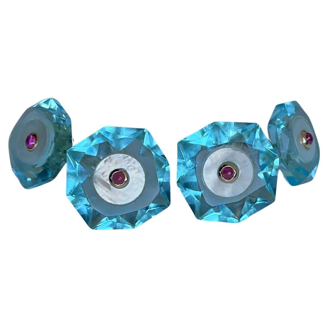 These beautiful and delicate octagonal cufflinks are made of pale blue topaz, whose delicate shade highlights the octagonal, multifaceted silhouette of both front face and toggle that is shaped as the front face but smaller. 
The center of each