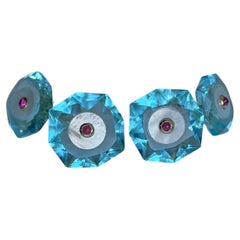 Gemelos octogonales de oro amarillo de 18 quilates con rubí, topacio azul pálido y madreperla