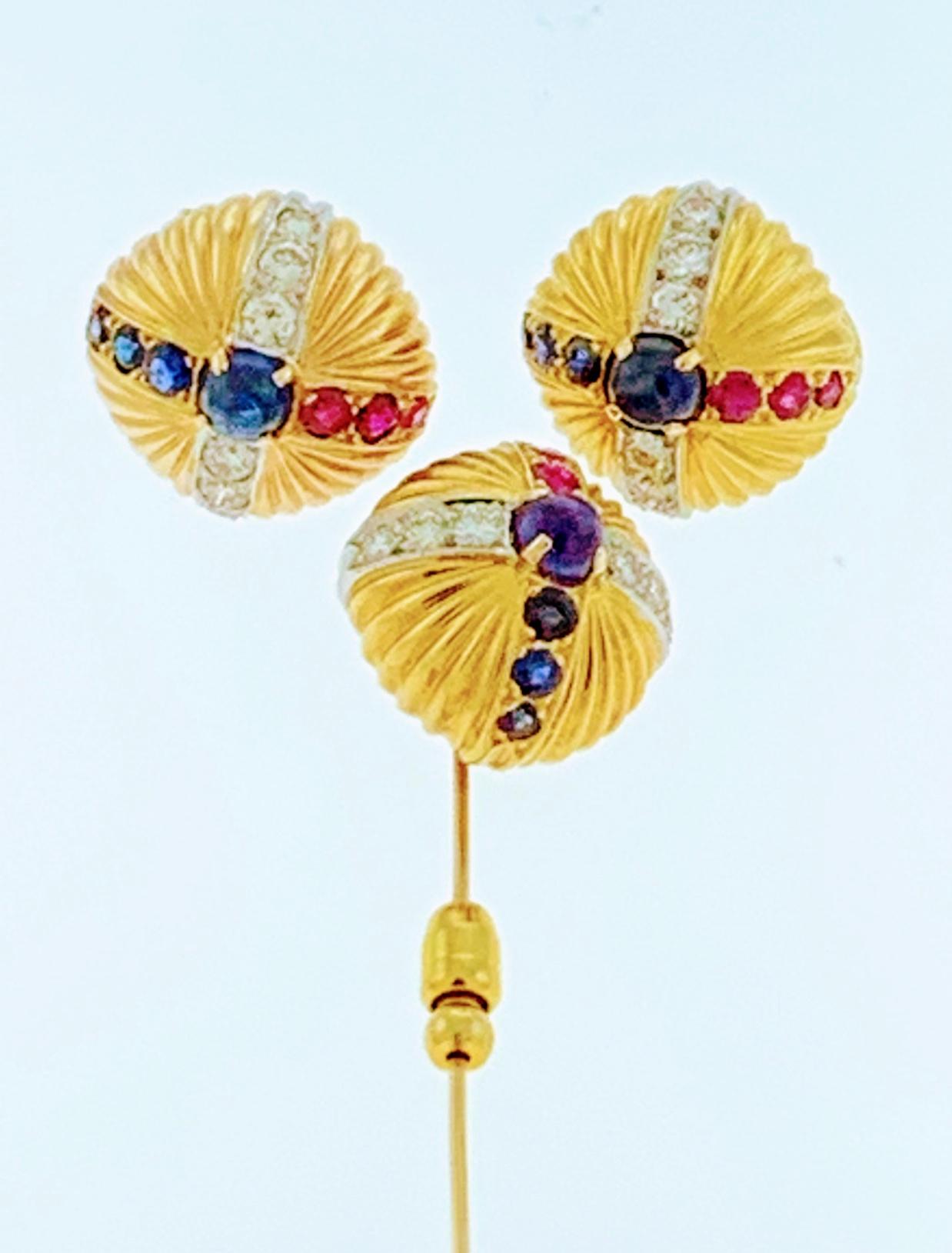  18 Karat Yellow Gold Ruby Sapphire & Diamond Earring And  Stick Pin Set Estate
Each earring has one round Cabochon sapphire in the center and three rubies and three sapphires with brilliant cut diamonds to form a cross.
Stick pin has same pattern