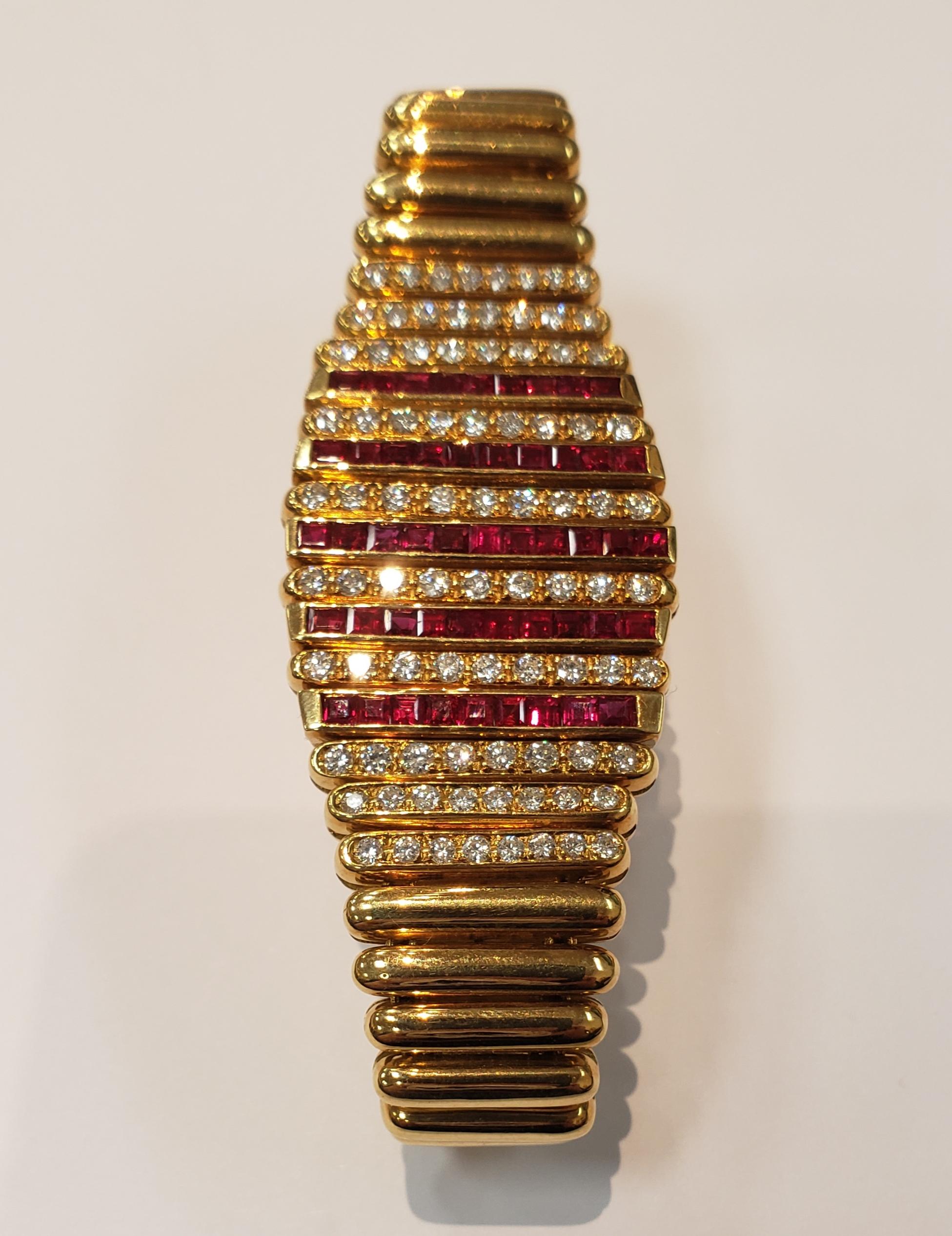 This bracelet makes a statement. 18 karat yellow gold flexible bracelet with 5 alternating rows of invisible set square rubies, and 10 rows of pave set diamonds. Rubies=2.50 carats Diamonds=3.70 carats. Each link is hinged for extra fluidity.