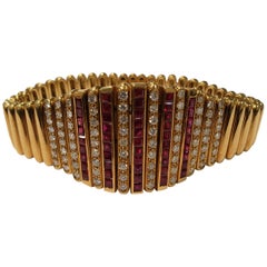 18 Karat Yellow Gold Salavetti Bracelet with Invisible Set Rubies and Diamonds