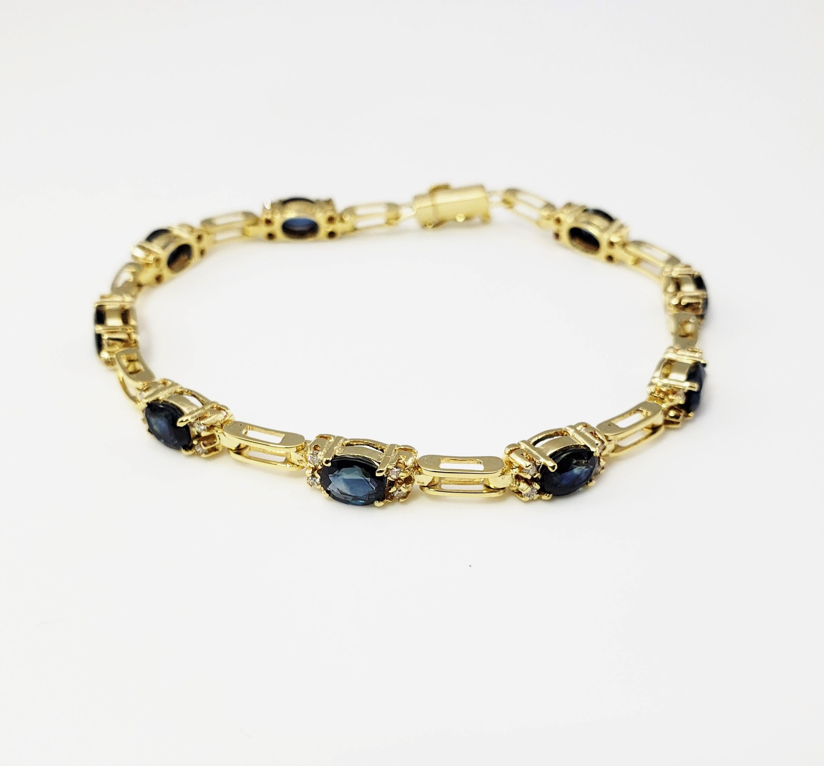 Vintage 18 Karat Yellow Gold Sapphire and Diamond Bracelet-

This stunning bracelet features nine oval sapphires (6 mm x 4 mm) and 36 round brilliant cut diamonds* set in beautifully detailed 18K yellow gold. Safety closure.

* One diamond has chip