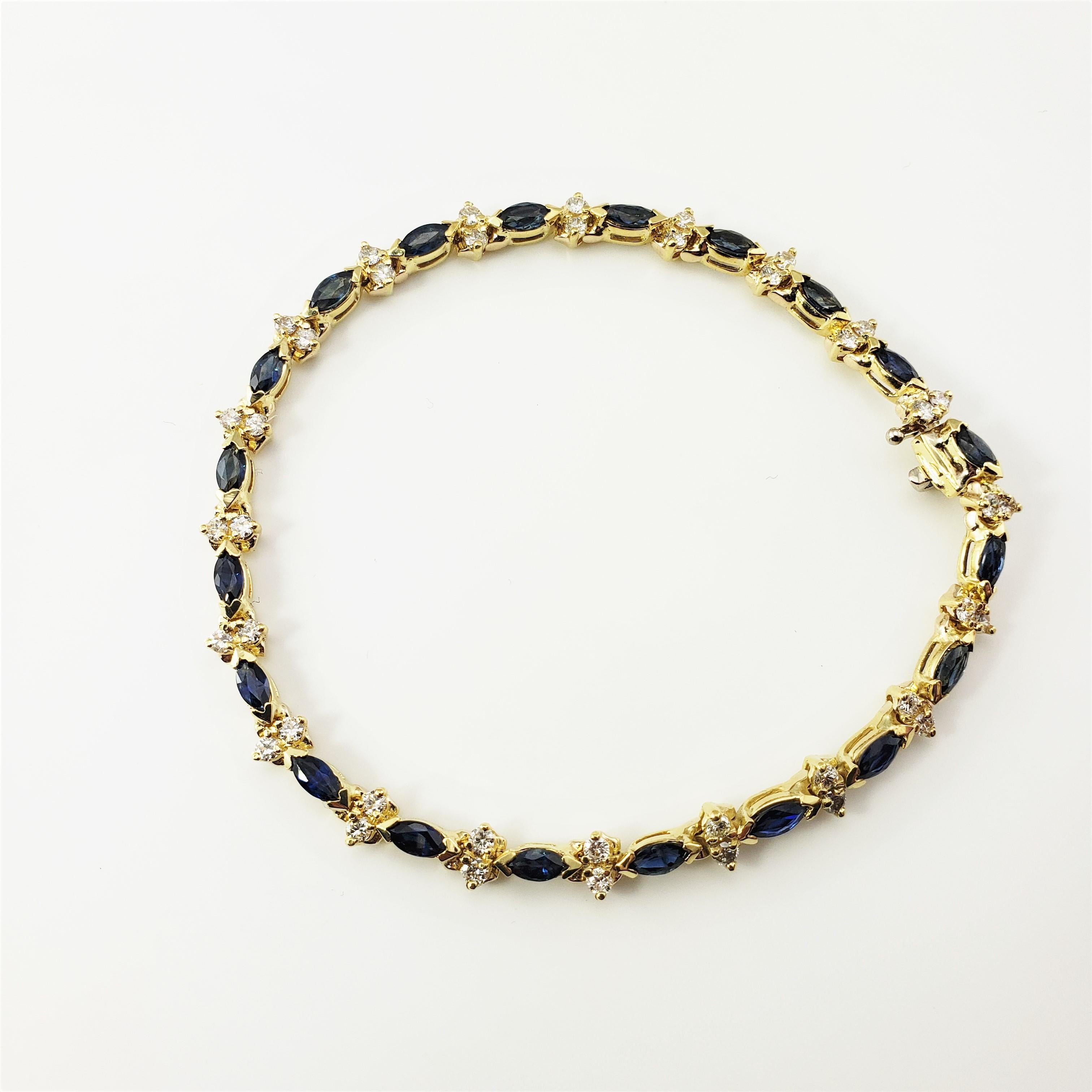 Vintage 18 Karat Yellow Gold Natural Sapphire and Diamond Bracelet-

This stunning bracelet features 20 natural marquis sapphires (approx. 6 mm x 3 mm) and 40 round brilliant cut diamonds set in classic 18K yellow gold.  

Width: 5 mm.

Approximate