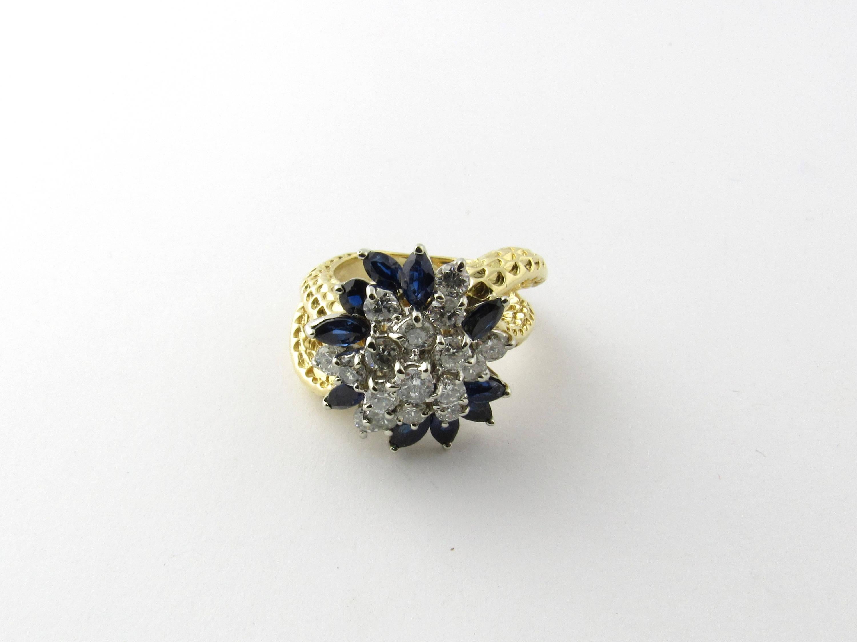 Vintage 18K Yellow Gold Sapphire and Diamond Floral Cocktail Ring Size 7

This ring is a bright sparkly statement piece with so much style!

The front of the ring is a floral design set with 10 genuine marquis sapphires and 15 round brilliant