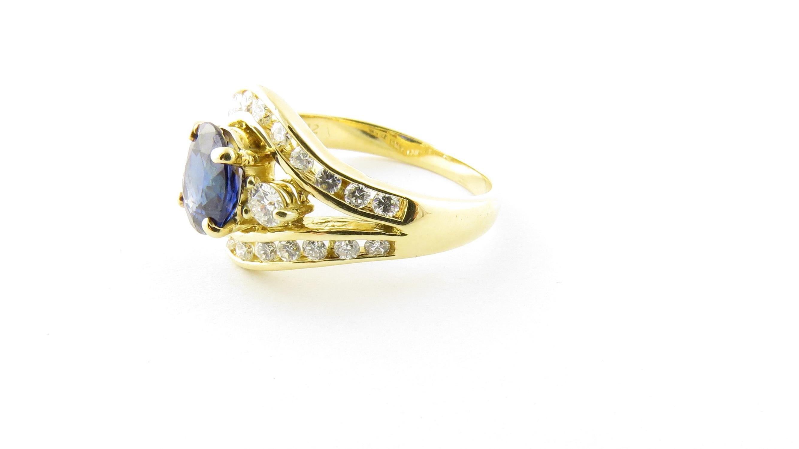 Vintage 18 Karat Yellow Gold Sapphire and Diamond Ring Size 6

This stunning ring features one oval sapphire (7 mm x 6 mm) surrounded by 26 round brilliant cut diamonds set in classic 18K yellow gold. Top of ring measures 12 mm. Shank measures 2 mm.