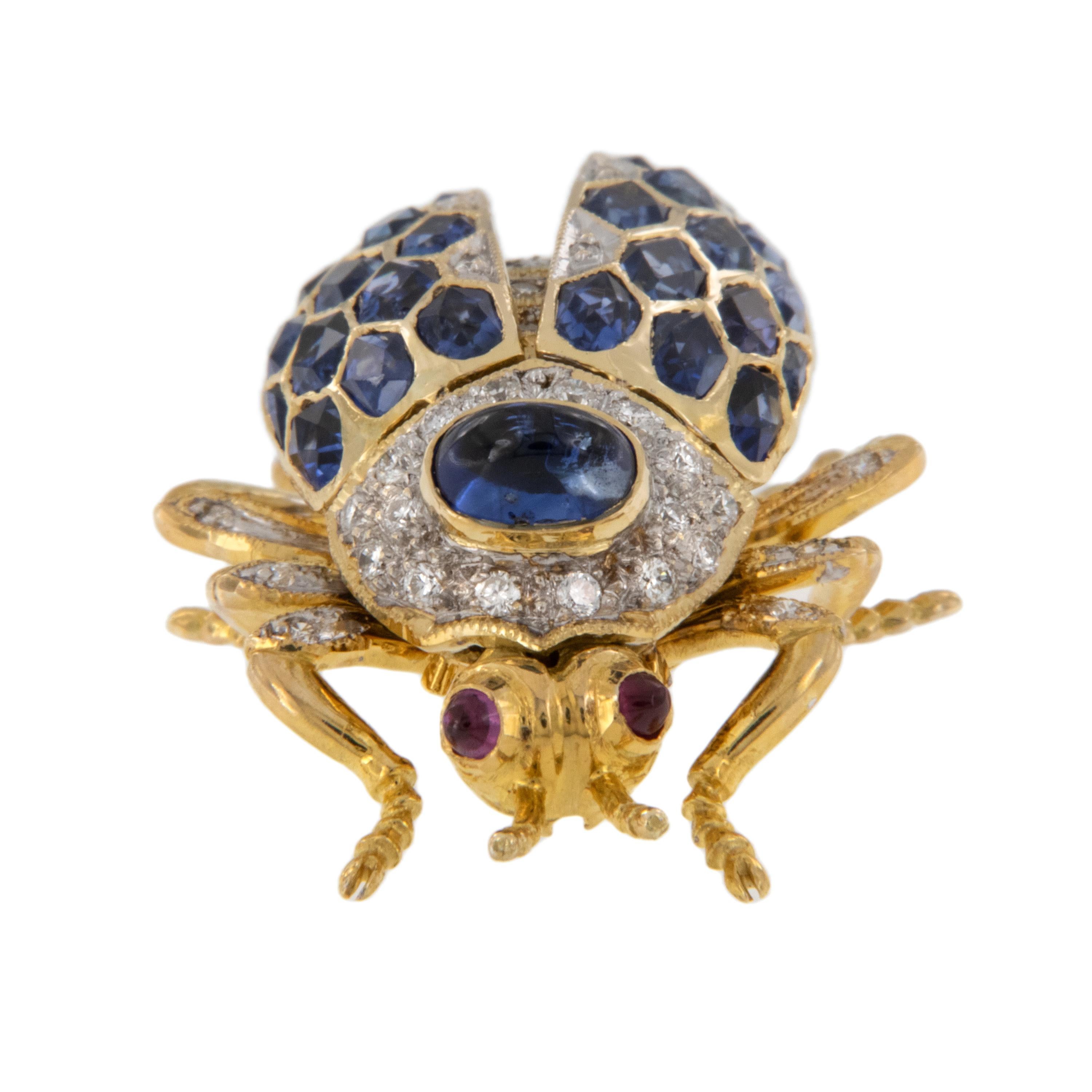 Scarab beetles have been regarded as very important in Egyptian jewelry for centuries! This fully articulated gorgeous beetle is adorned with approximately 6.00 cttw blue sapphires & 0.17 Cttw diamonds for a perfectly bejeweled look with two small