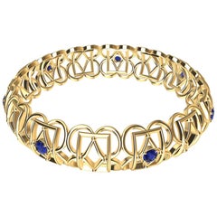 Bracelet jonc rectangulaire en or jaune 18 carats et saphirs en forme de losange
