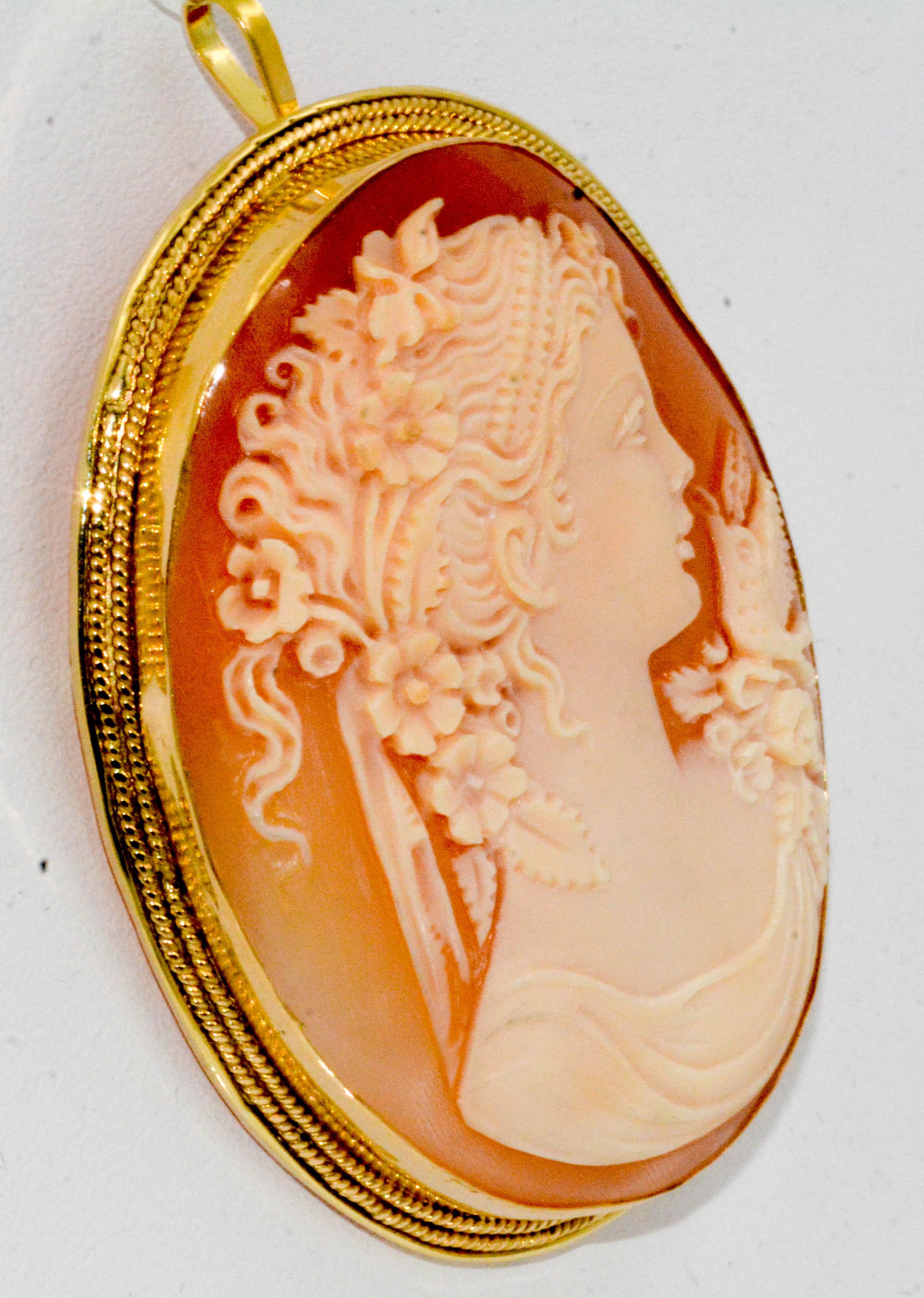 The craftsmanship is spectacular! Look at the details and the intricacy of each detail. 
This Victorian Cameo is beautiful to behold and is surrounded with an 18 karat yellow gold bezel, pin and pendant bale.
This lovely shell Cameo brooch is circa