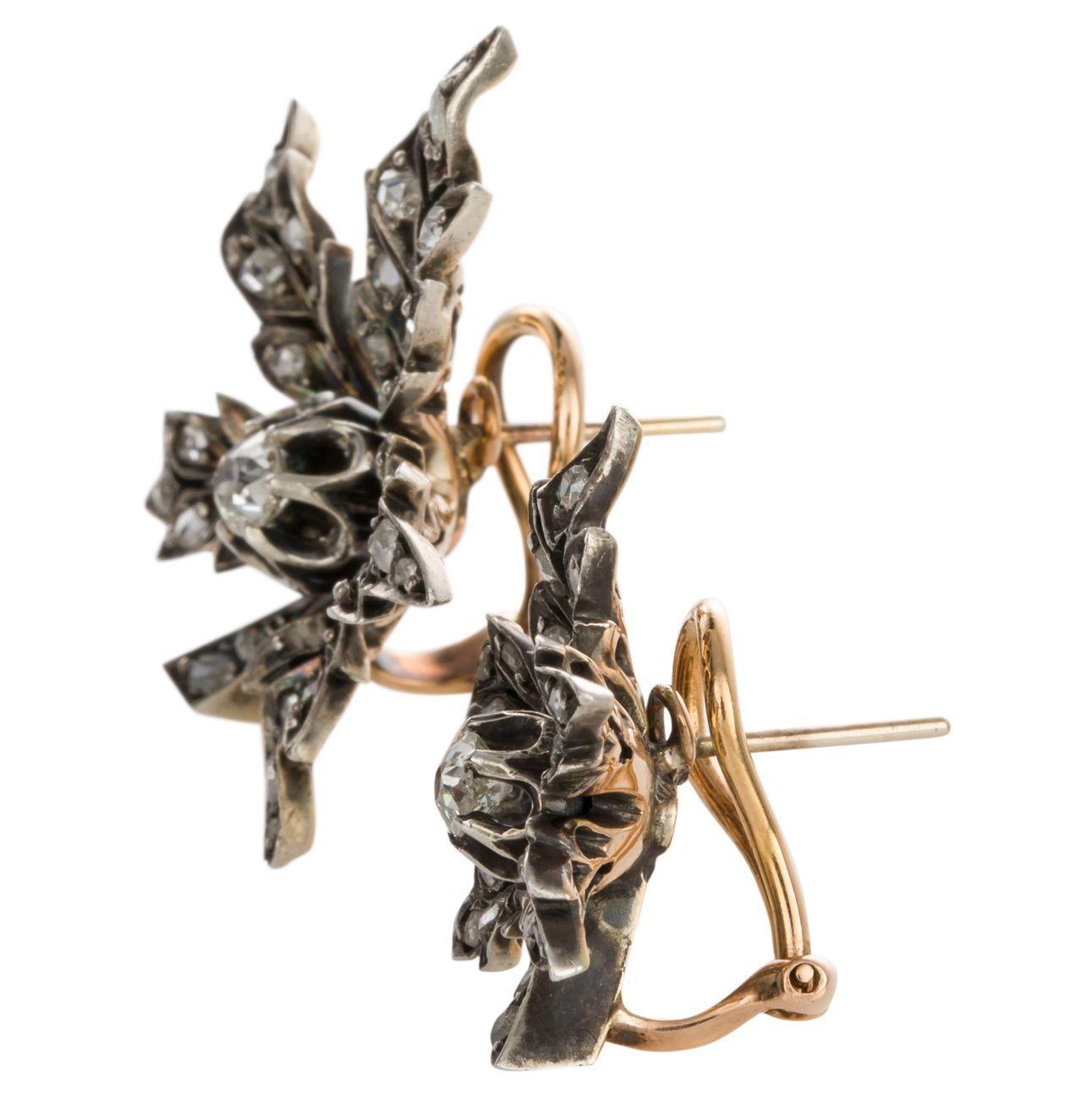 Everything old is new again! These wonderful 'mismatched' antique components from the 1880's have a new life as a unique pair of pierced earrings. Once belonging to a larger ensemble of jewels, the two leaf components have been transported into the